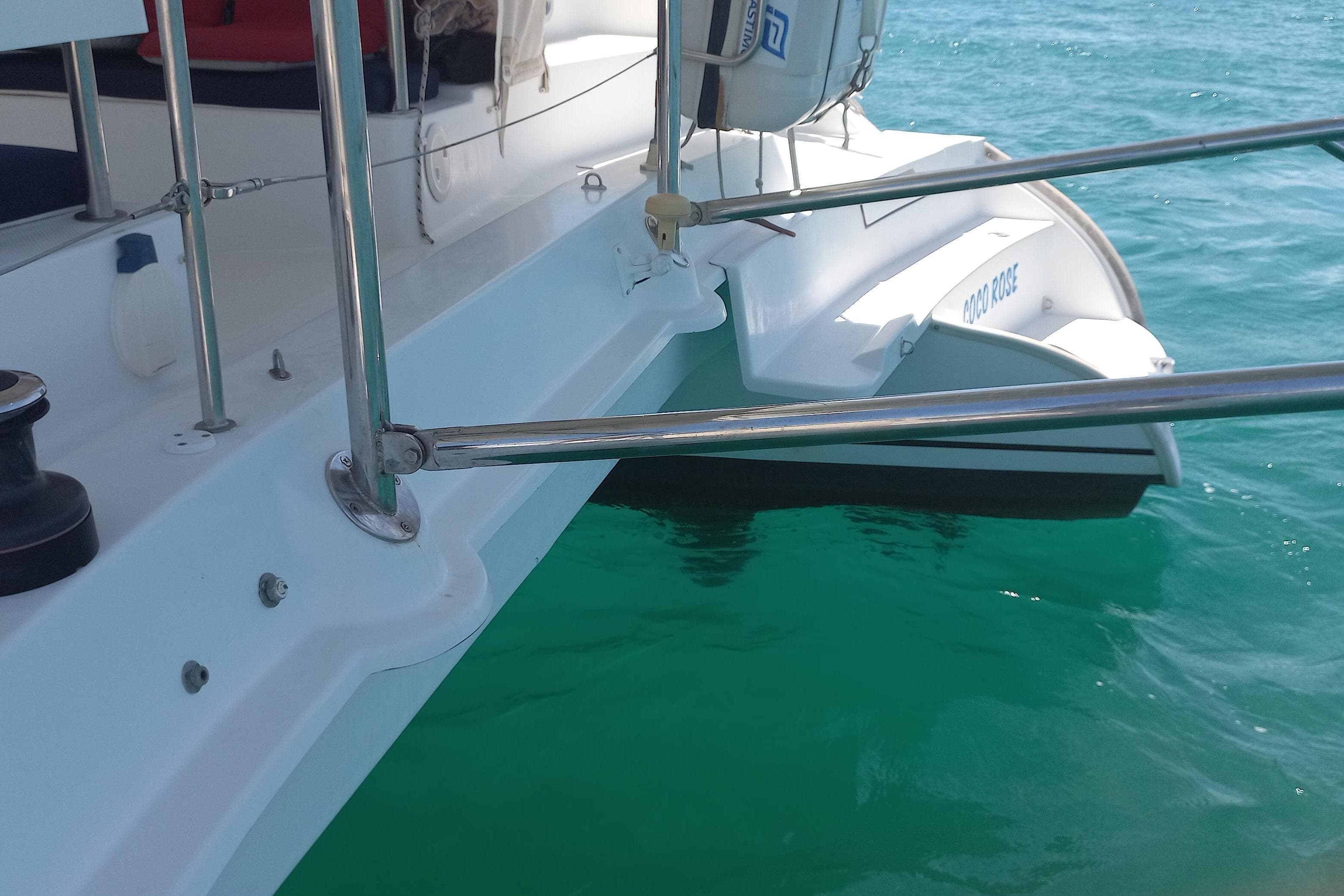 2010 Fountaine Pajot Lipari 41 catamaran on turquoise water, showcasing deck and railing.