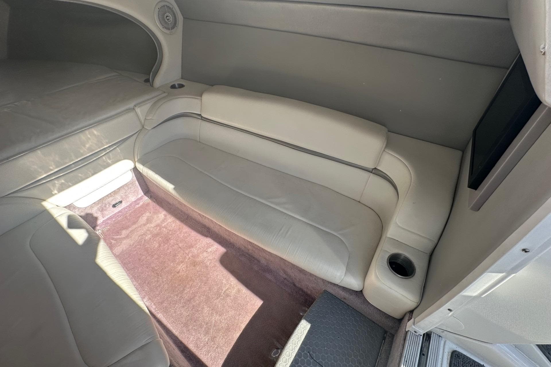 Interior of 2004 Formula 292 FASTech boat with beige seating and carpet.