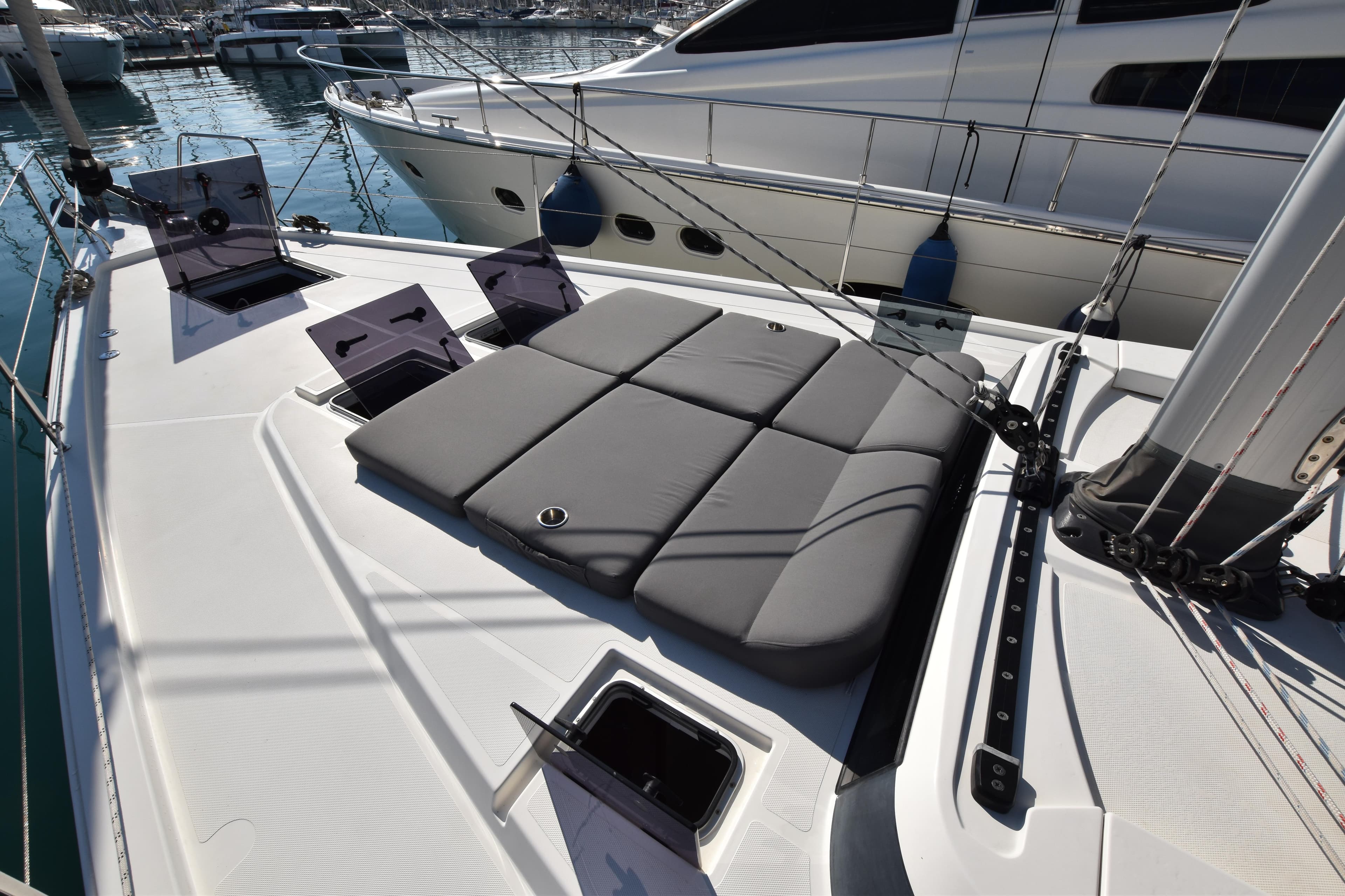 Luxury 20 Bavaria C57 yacht deck with cushioned sunbathing area, Corfu