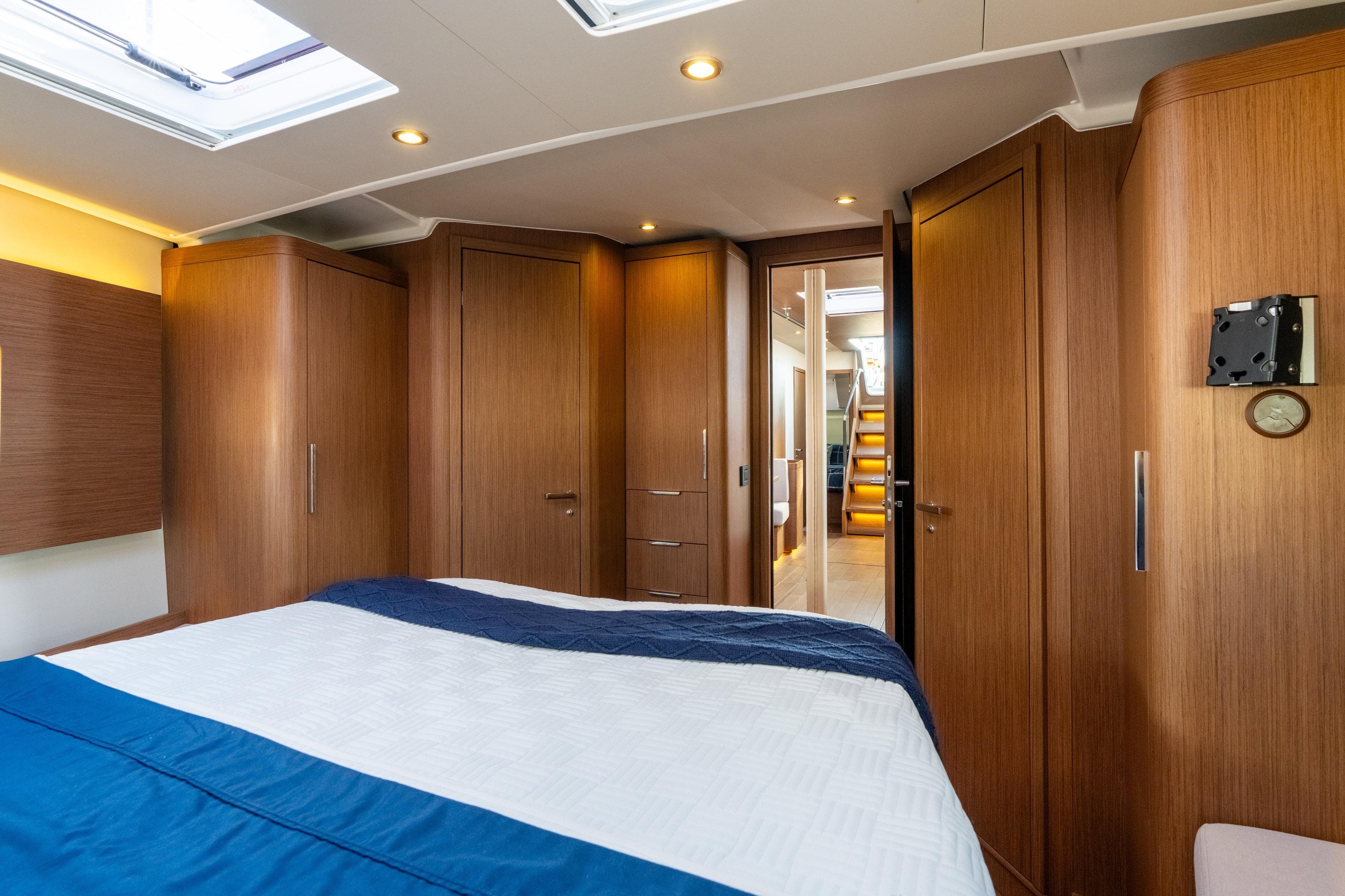 Luxurious interior of 2021 Beneteau Oceanis Yacht 54, featuring elegant wood finishes and modern design.