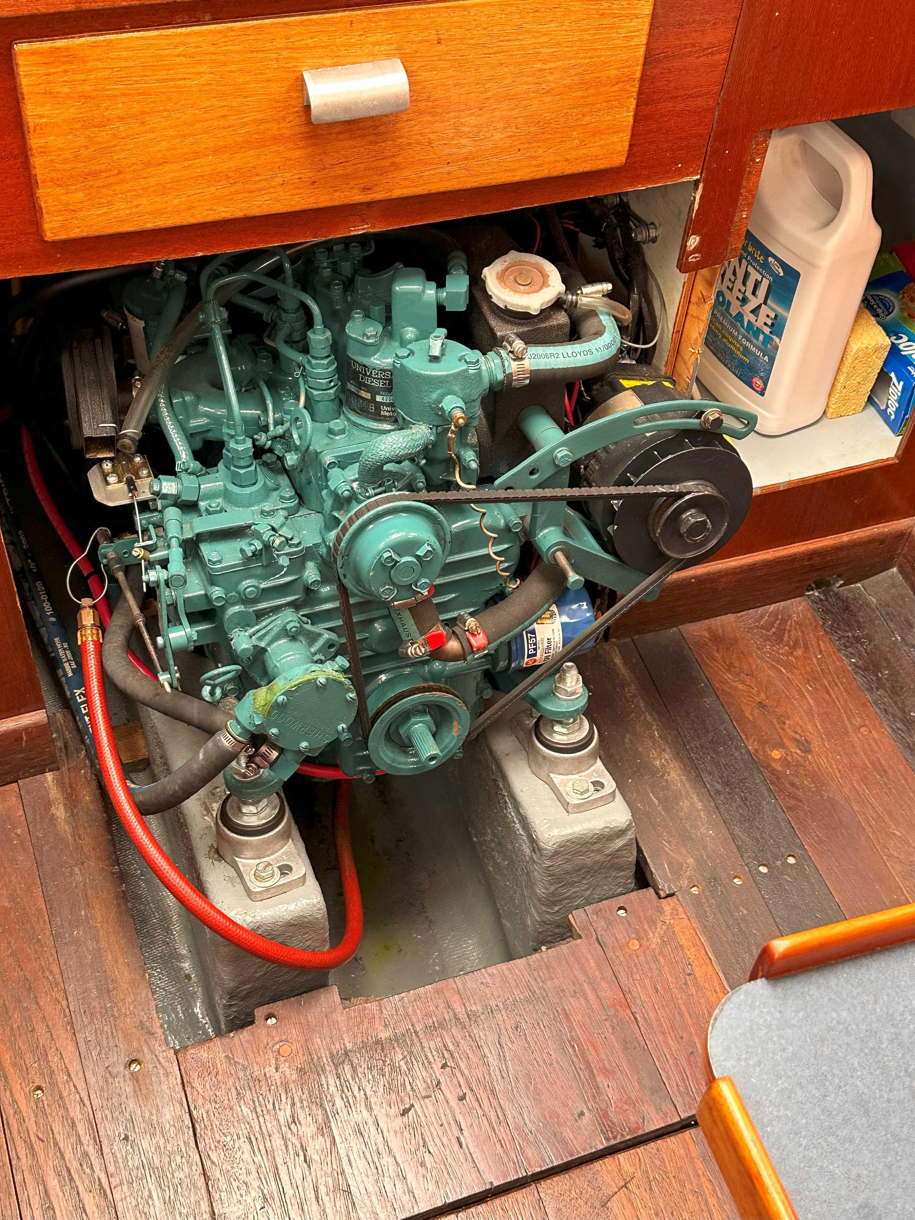 Engine compartment of a 1969 Contest 29 sailboat, featuring a well-maintained marine engine.