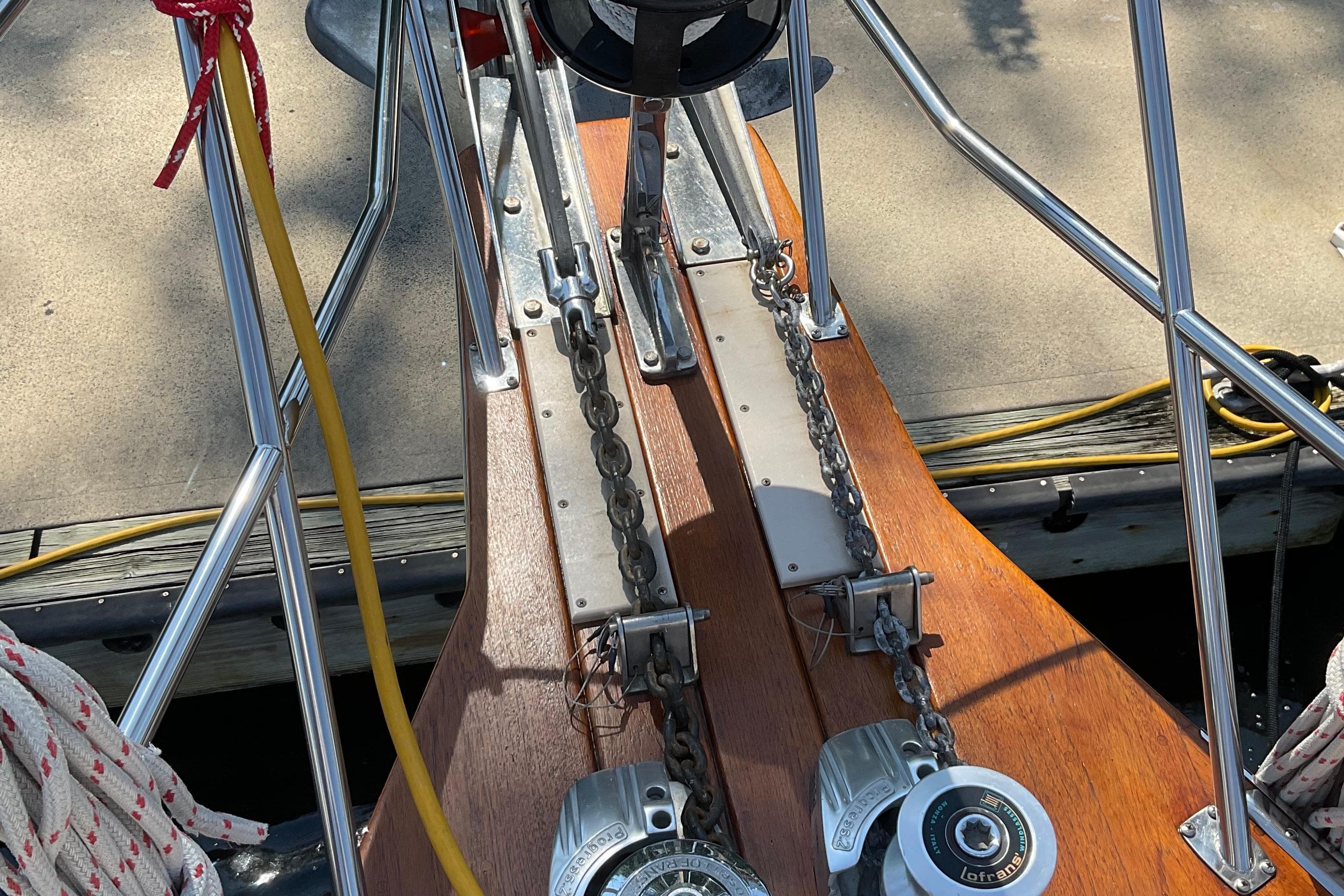 Bow of 2001 Island Packet 420 sailboat with anchor chains and winches.