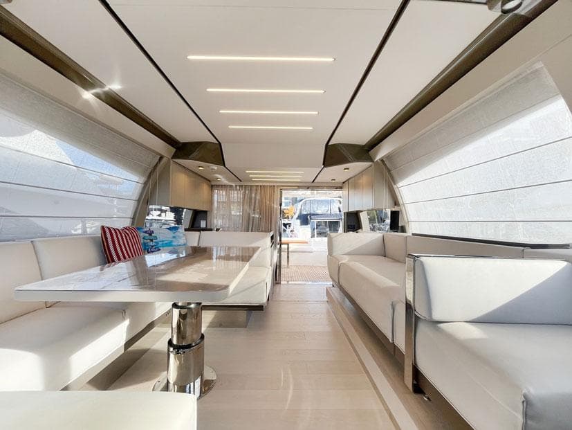 Luxurious interior of 2018 Ferretti Yachts 550, featuring elegant seating and modern design.