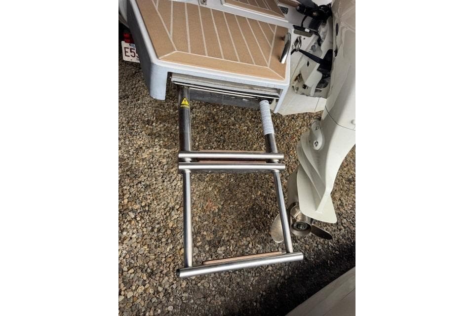 Zar Formenti 59 SL 2020 boat ladder, stainless steel, extended on gravel surface.