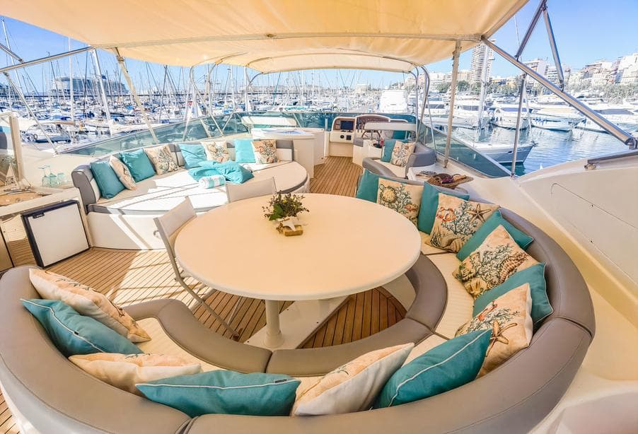 Luxurious 1997 Astondoa 95 GLX yacht deck with elegant seating and marina view.