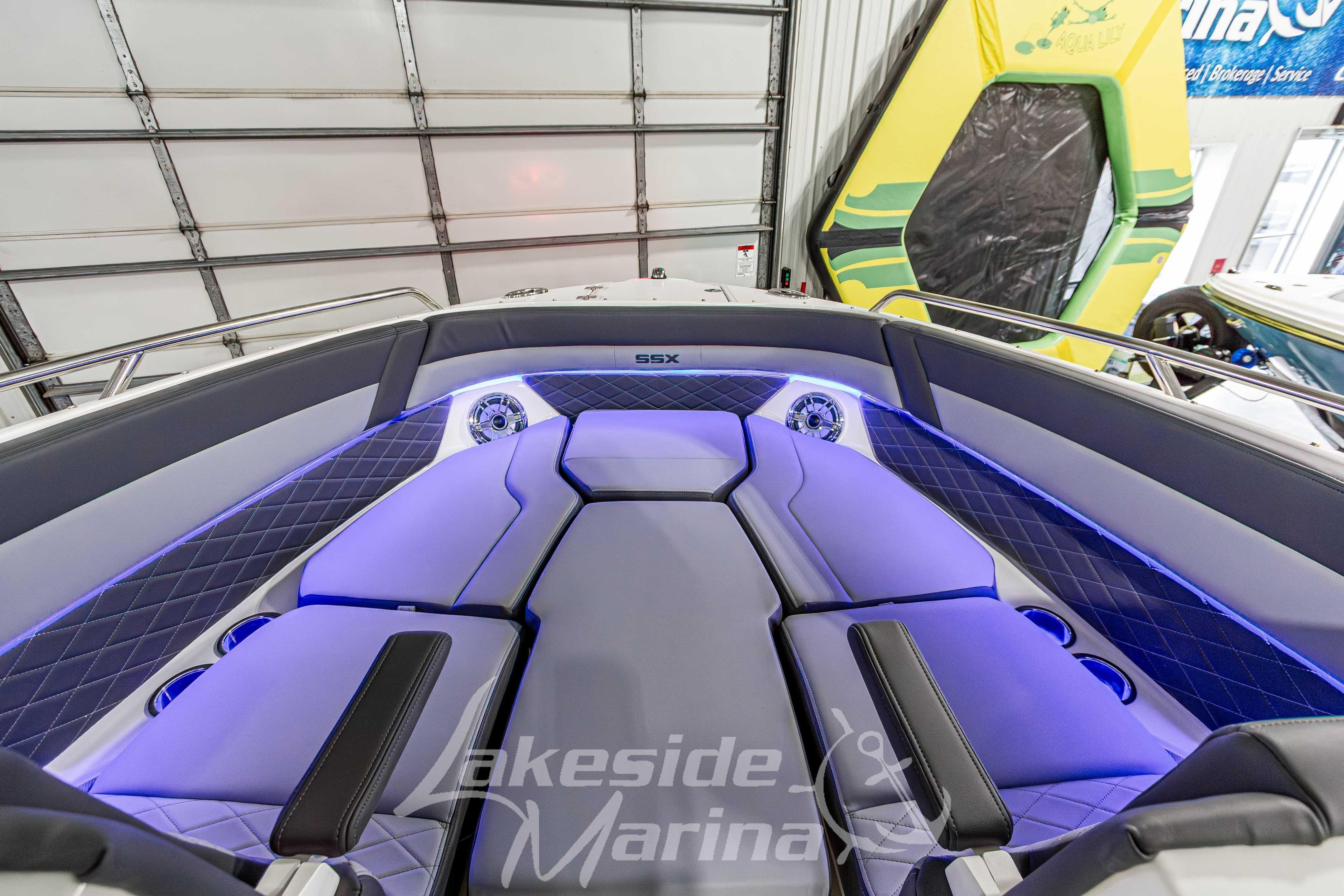 Luxurious interior of 2026 Chaparral SSX 6 boat with modern seating and ambient lighting.