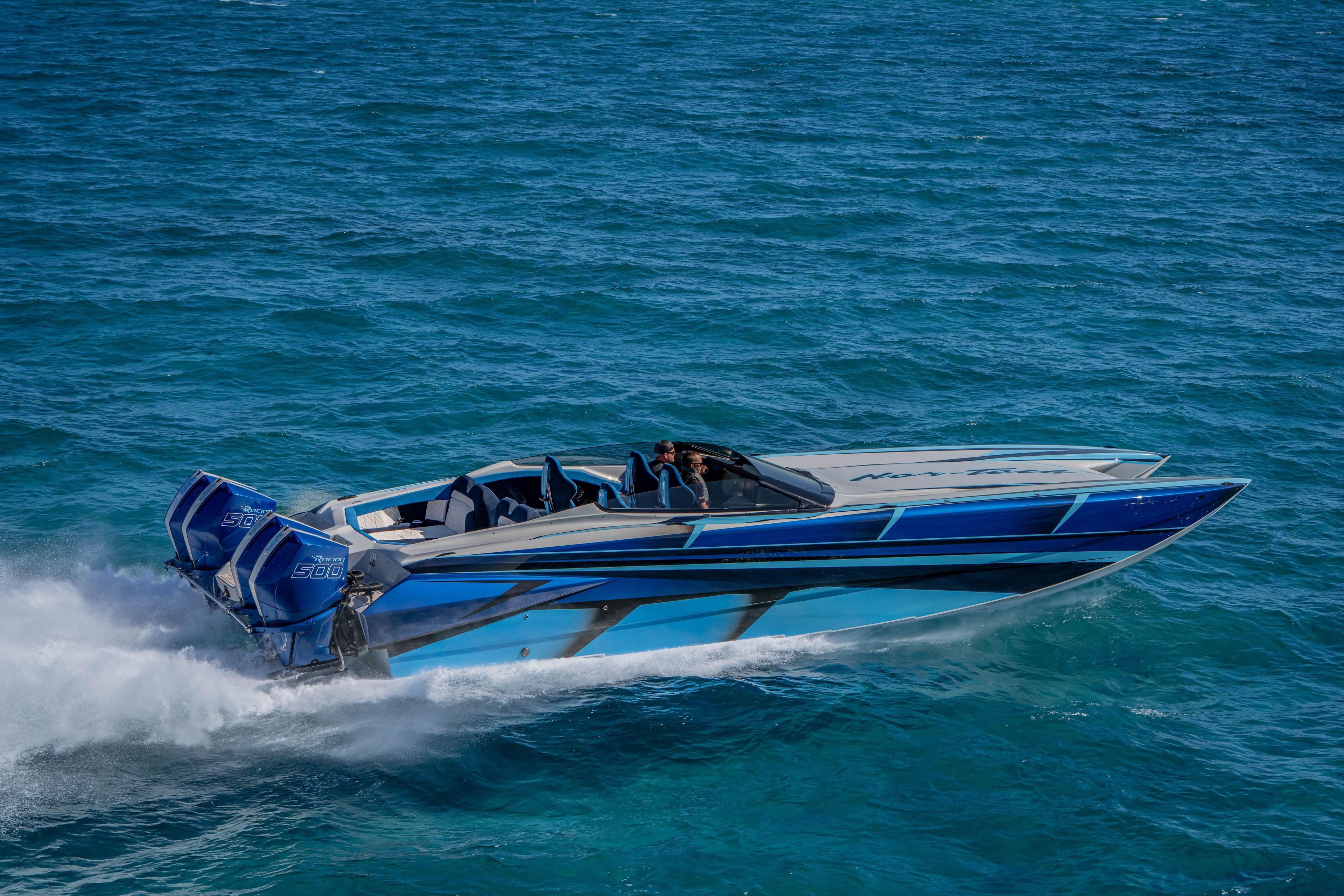 2026 Nor-Tech 4000 Super Catamaran speeding on open water, showcasing sleek design and powerful engines.