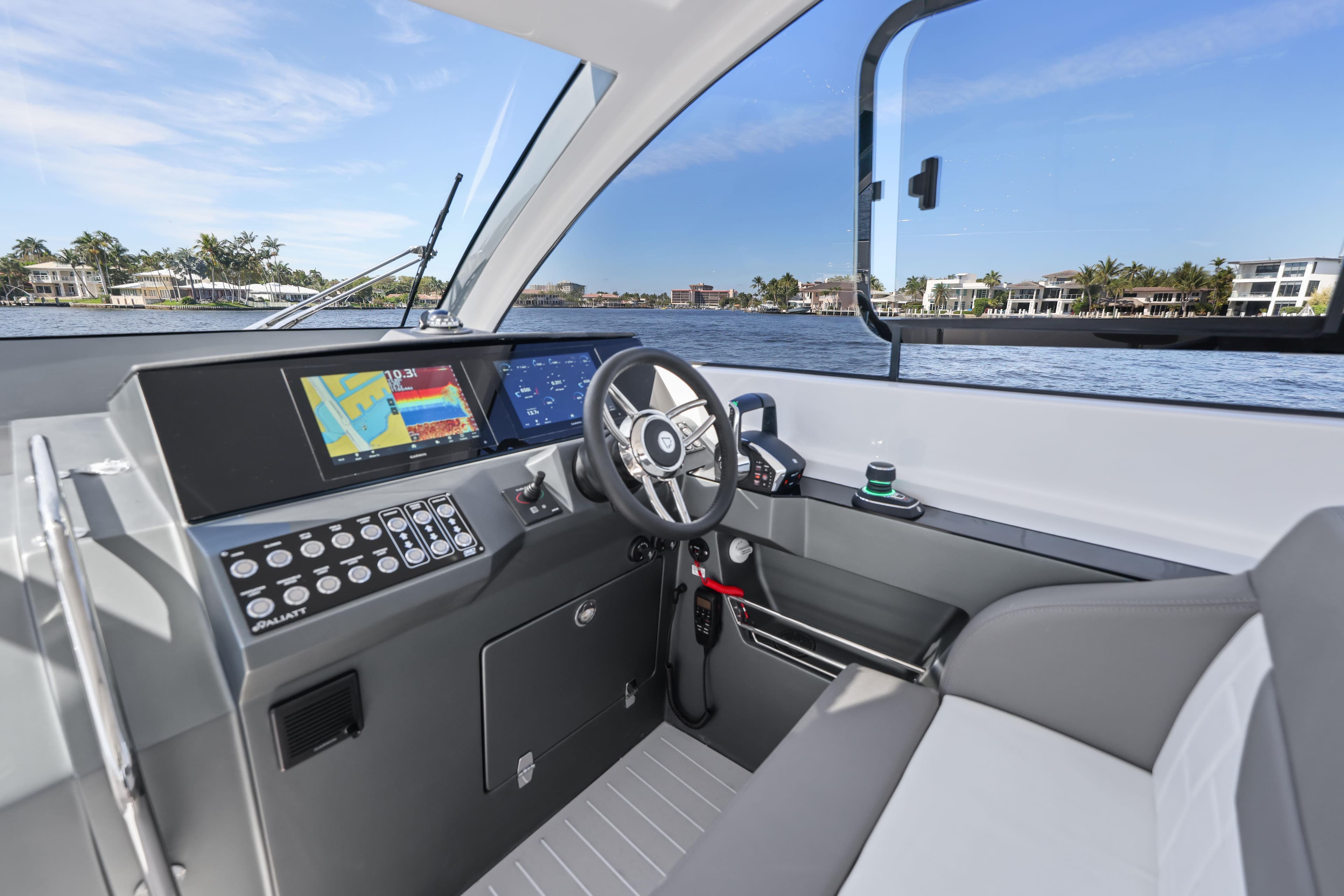 2025 Valiatt 380 Bowrider cockpit with modern controls and waterfront view.