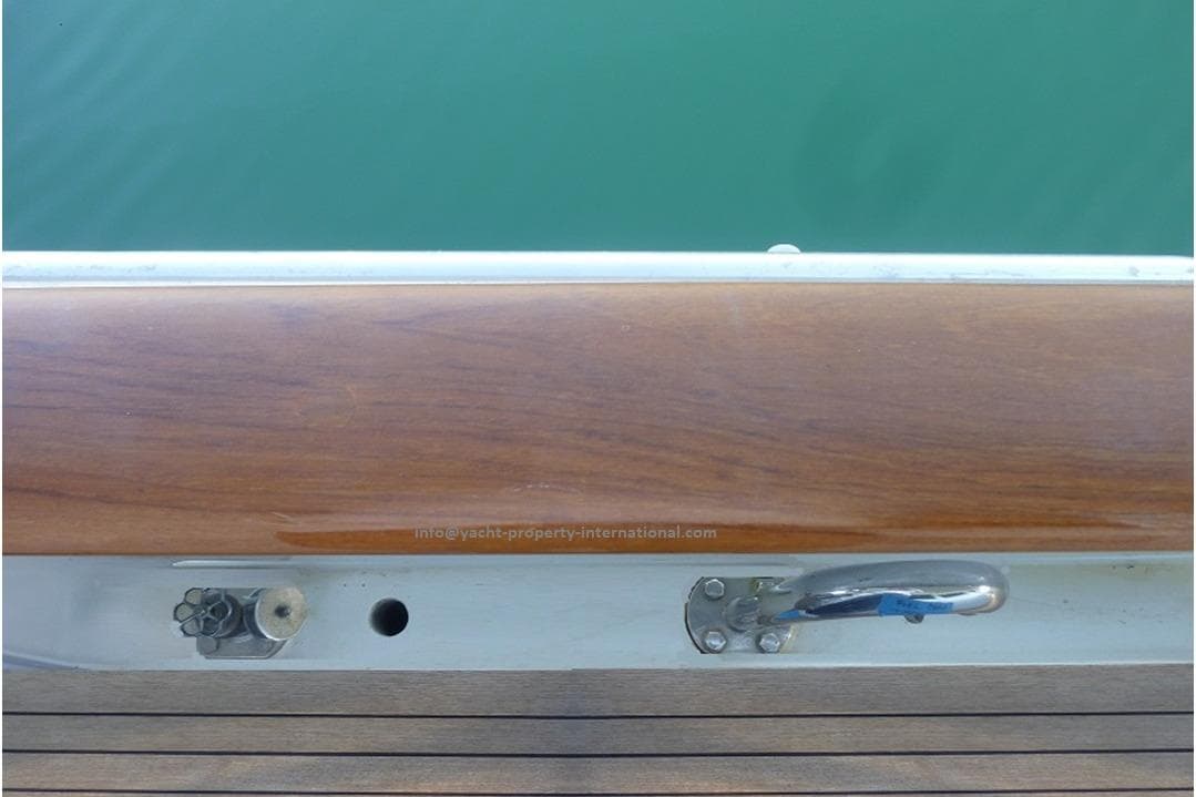 Deck detail of a 2015 Benetti 79 yacht, featuring wood and metal fittings.