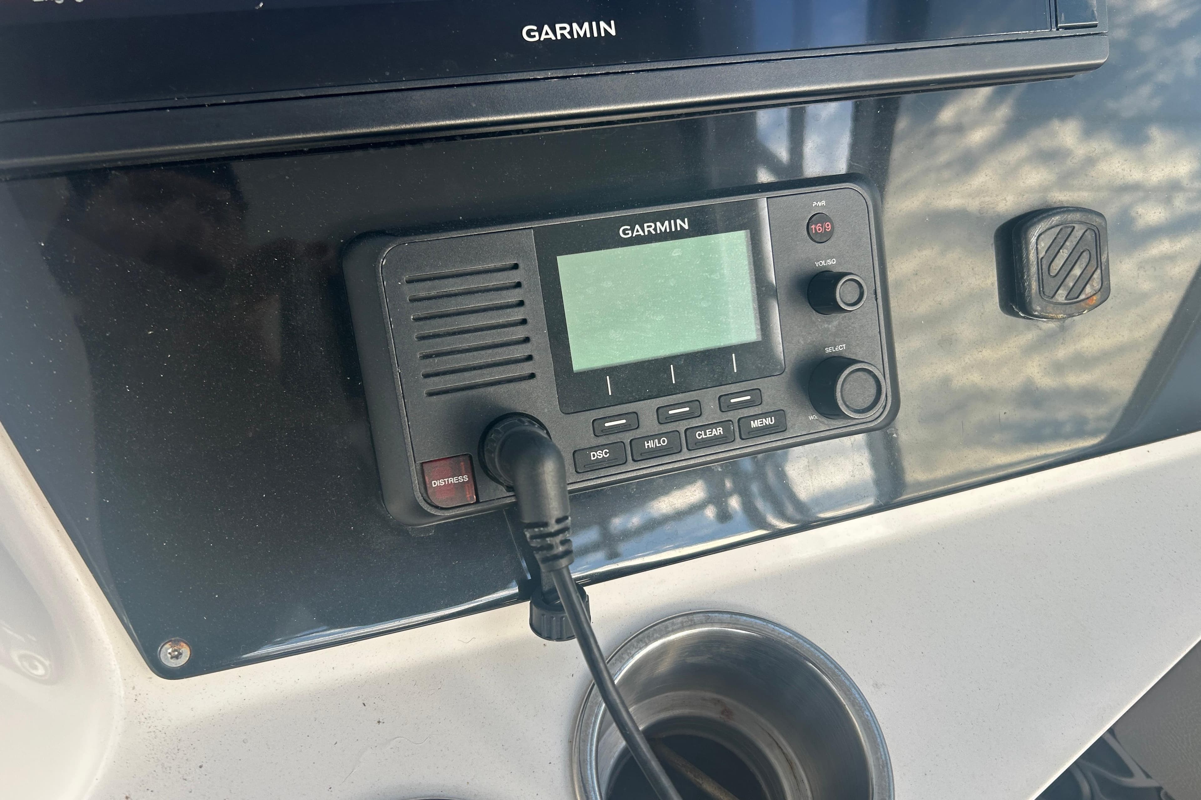 Garmin marine radio on 2007 Fountain 38 Sportfish Cruiser OB dashboard.