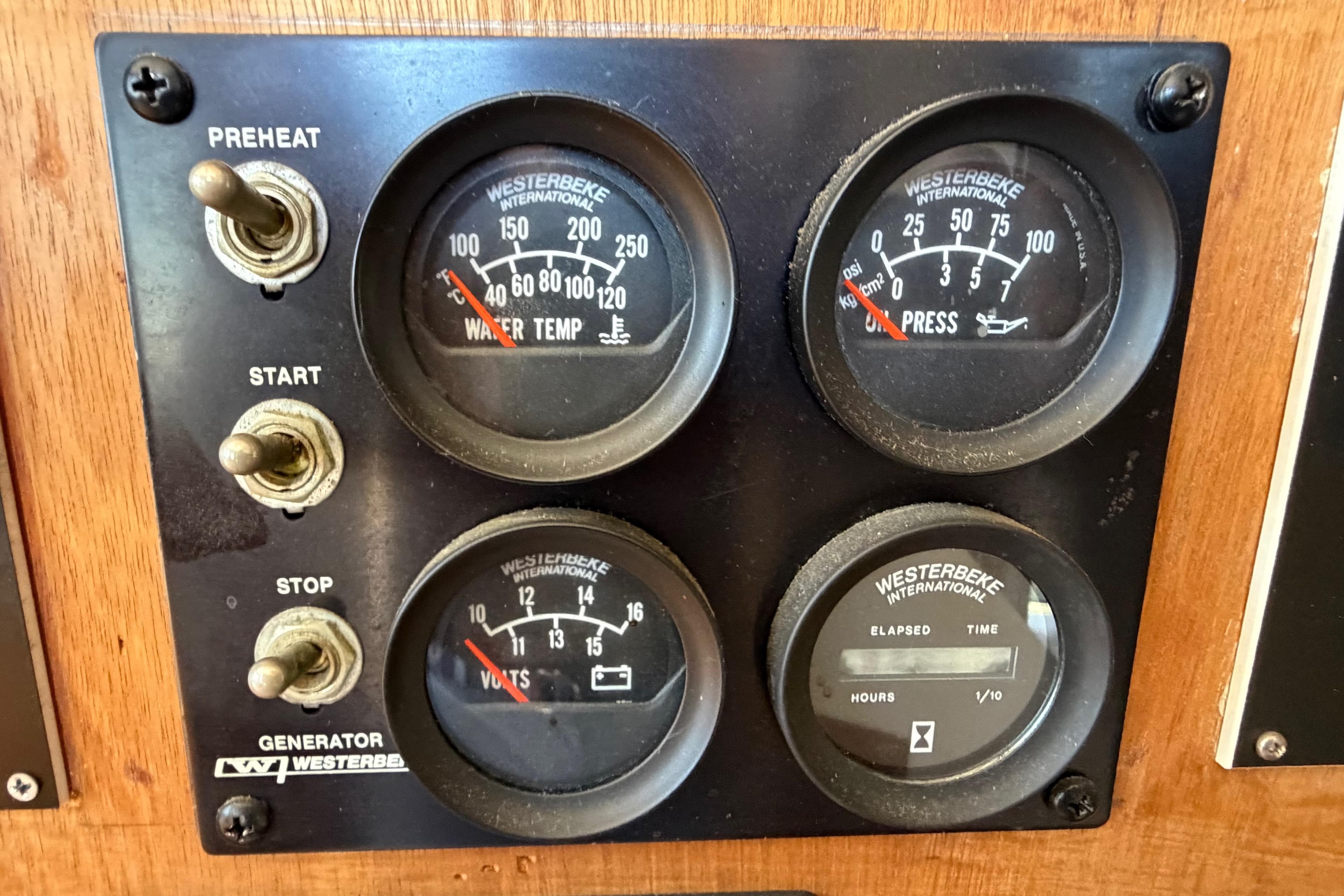 Control panel of a 1985 Gozzard PILGRIM with Westerbeke gauges and switches.