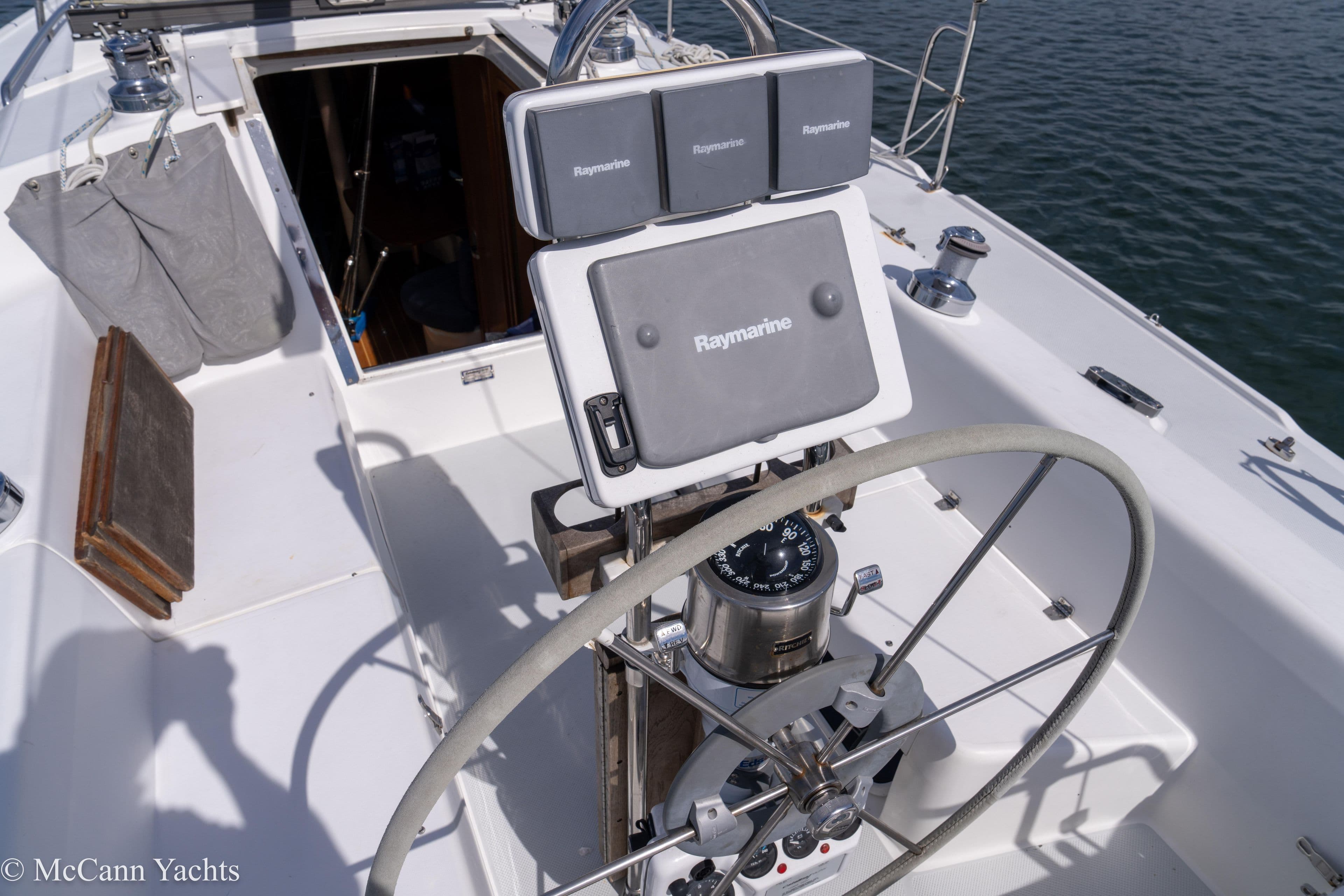 Cockpit of 2003 Catalina 320 sailboat with Raymarine navigation equipment.