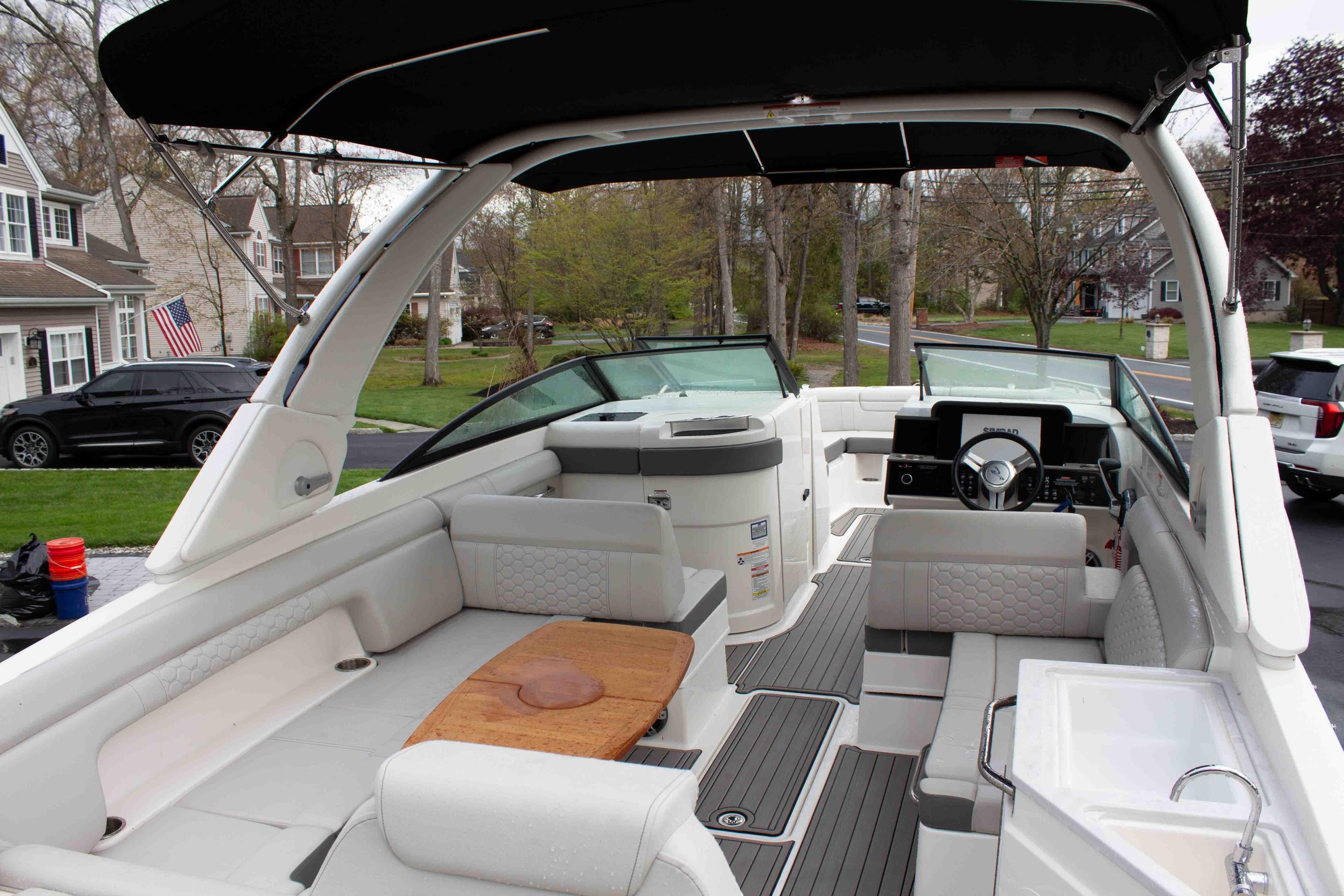 2024 Sea Ray SDX 290 boat interior with seating, steering wheel, and deck view.