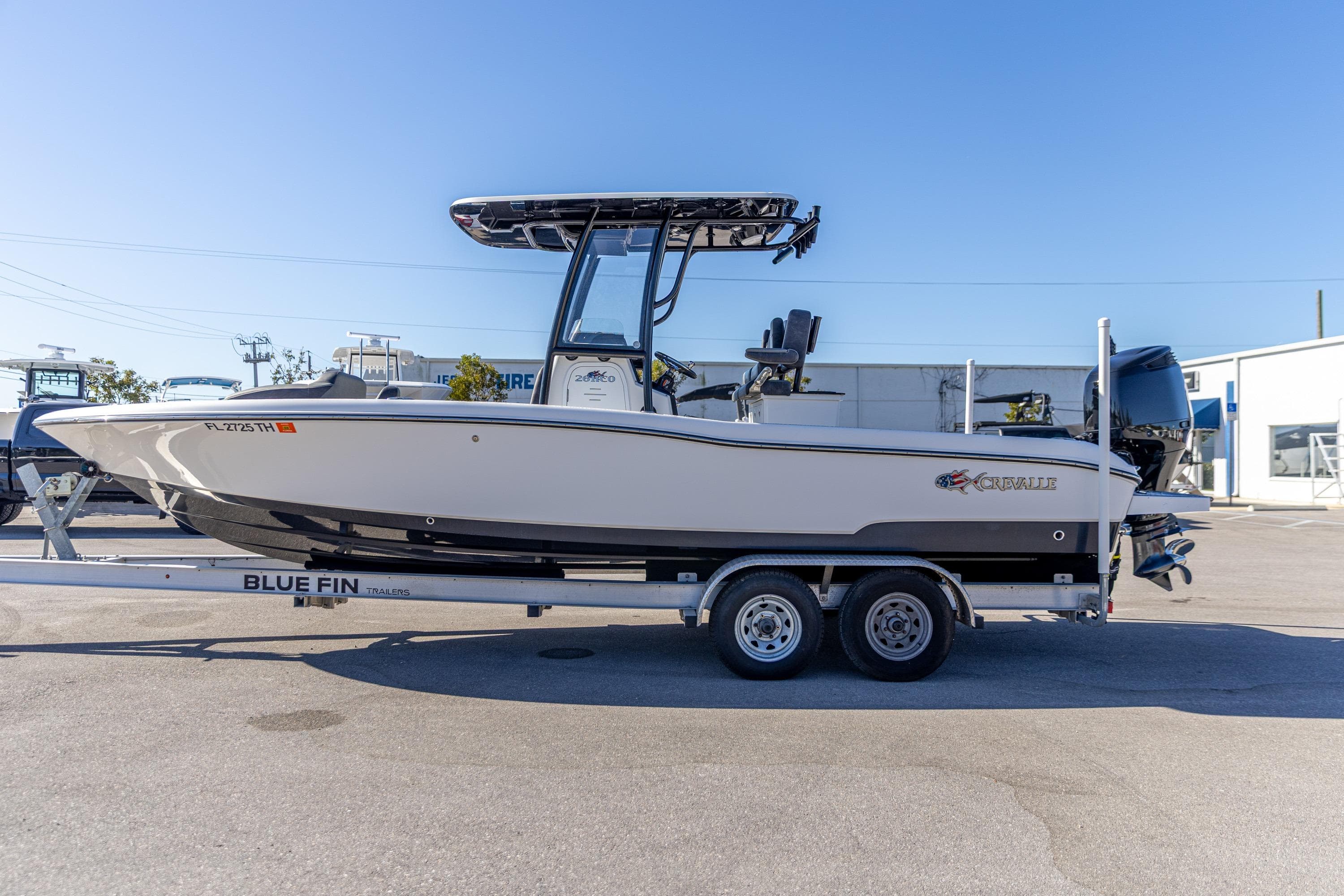 2022 Crevalle 26 HCO boat on Blue Fin trailer in a parking lot.