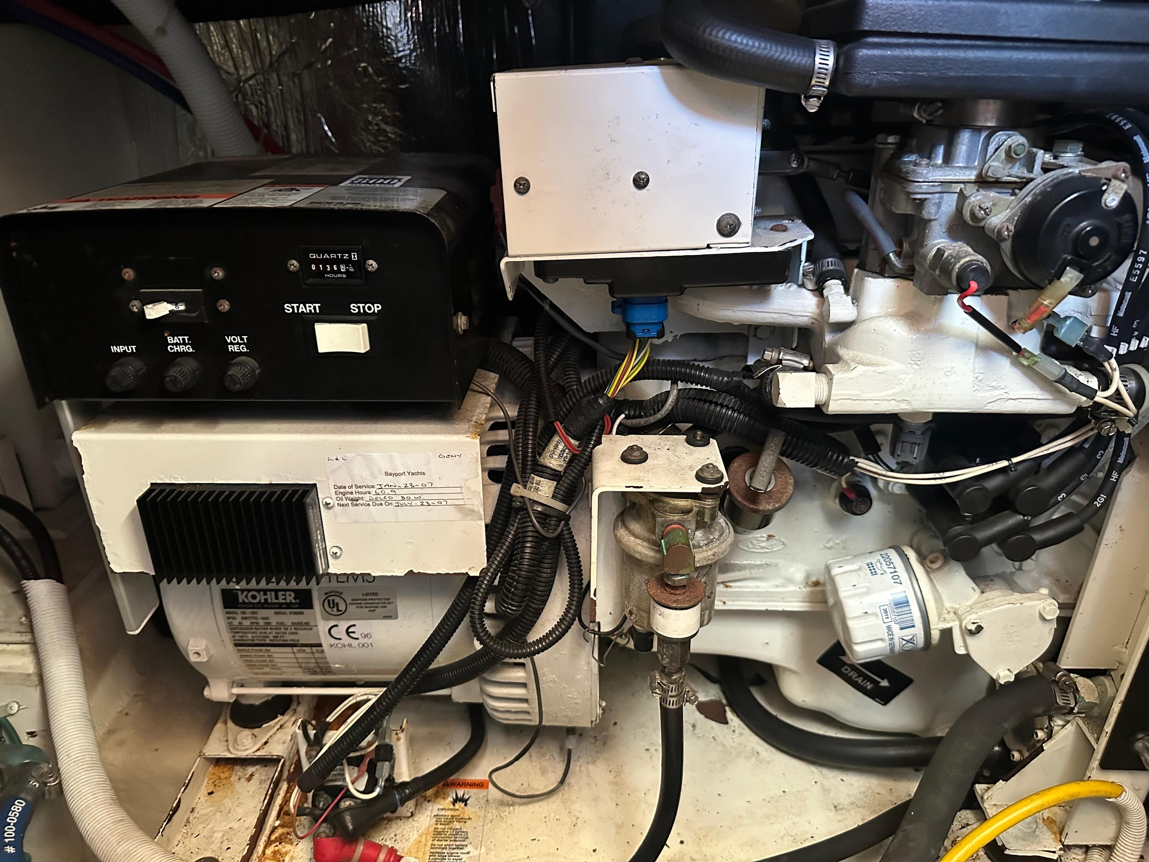 Engine room of 2004 Carver 396 Motor Yacht with Kohler generator.