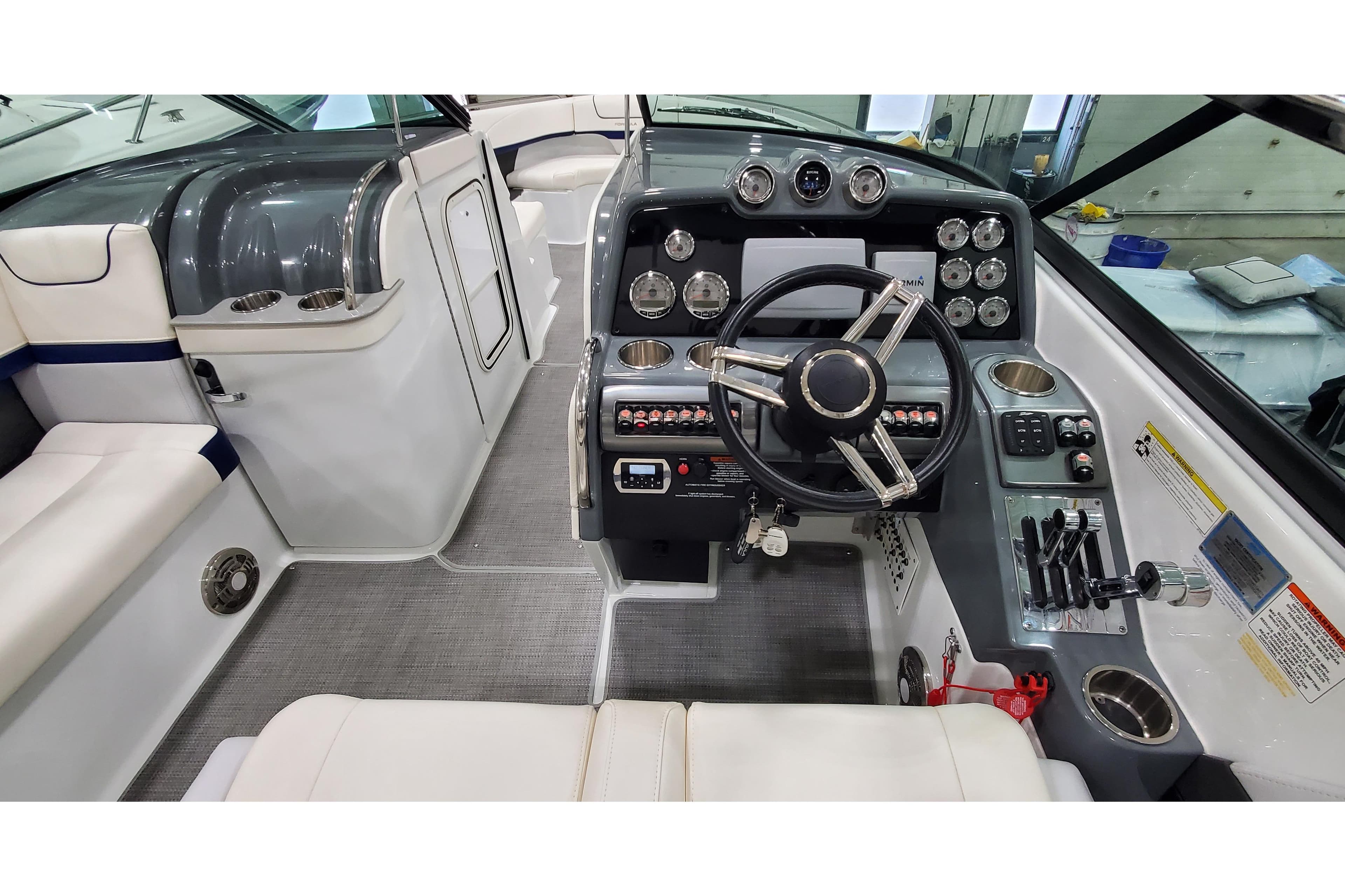 2013 Formula 310 Bowrider cockpit with modern controls and sleek design.