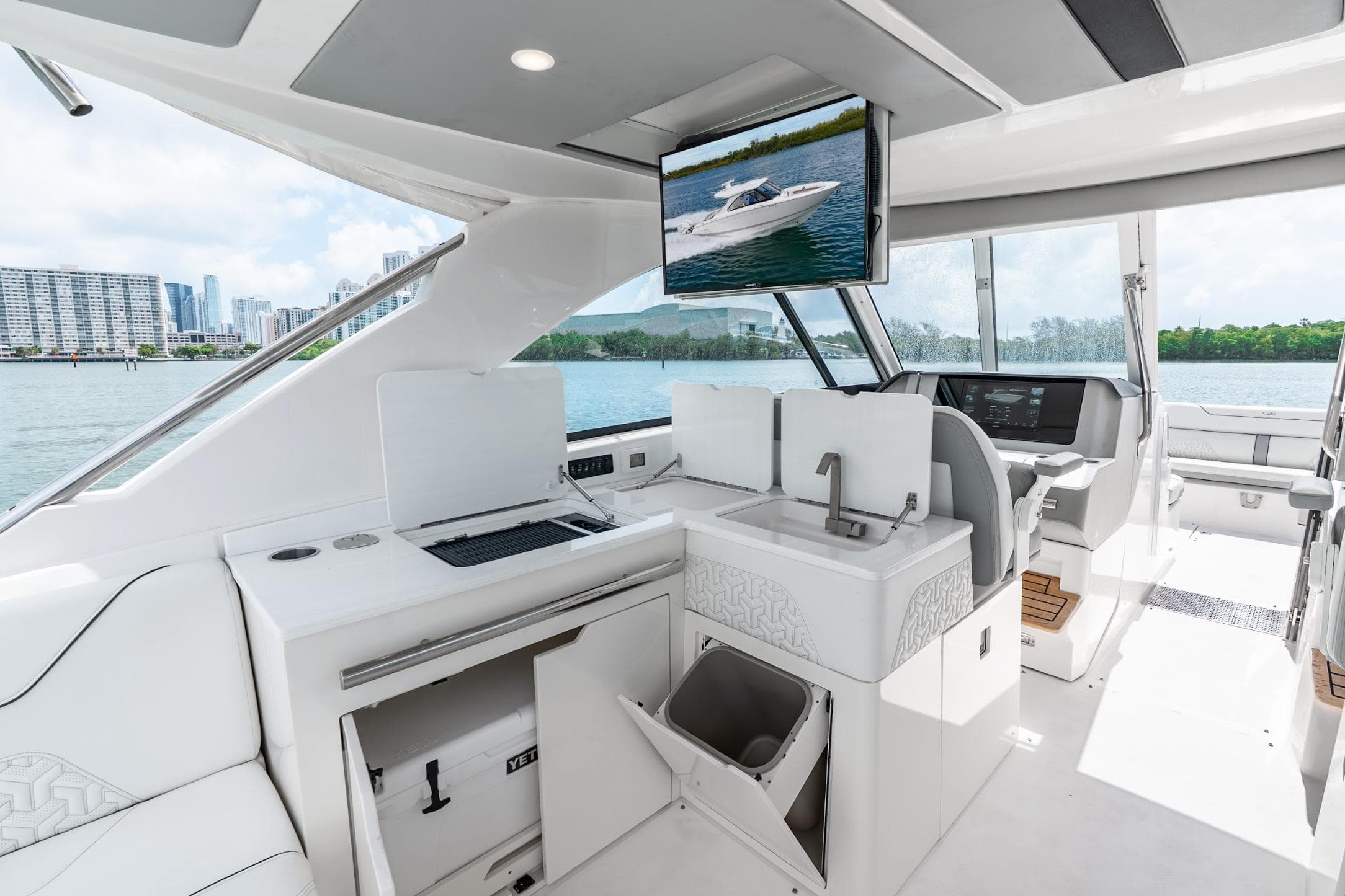 Luxurious 2023 Regal LX36 yacht interior with modern amenities and scenic waterfront view.