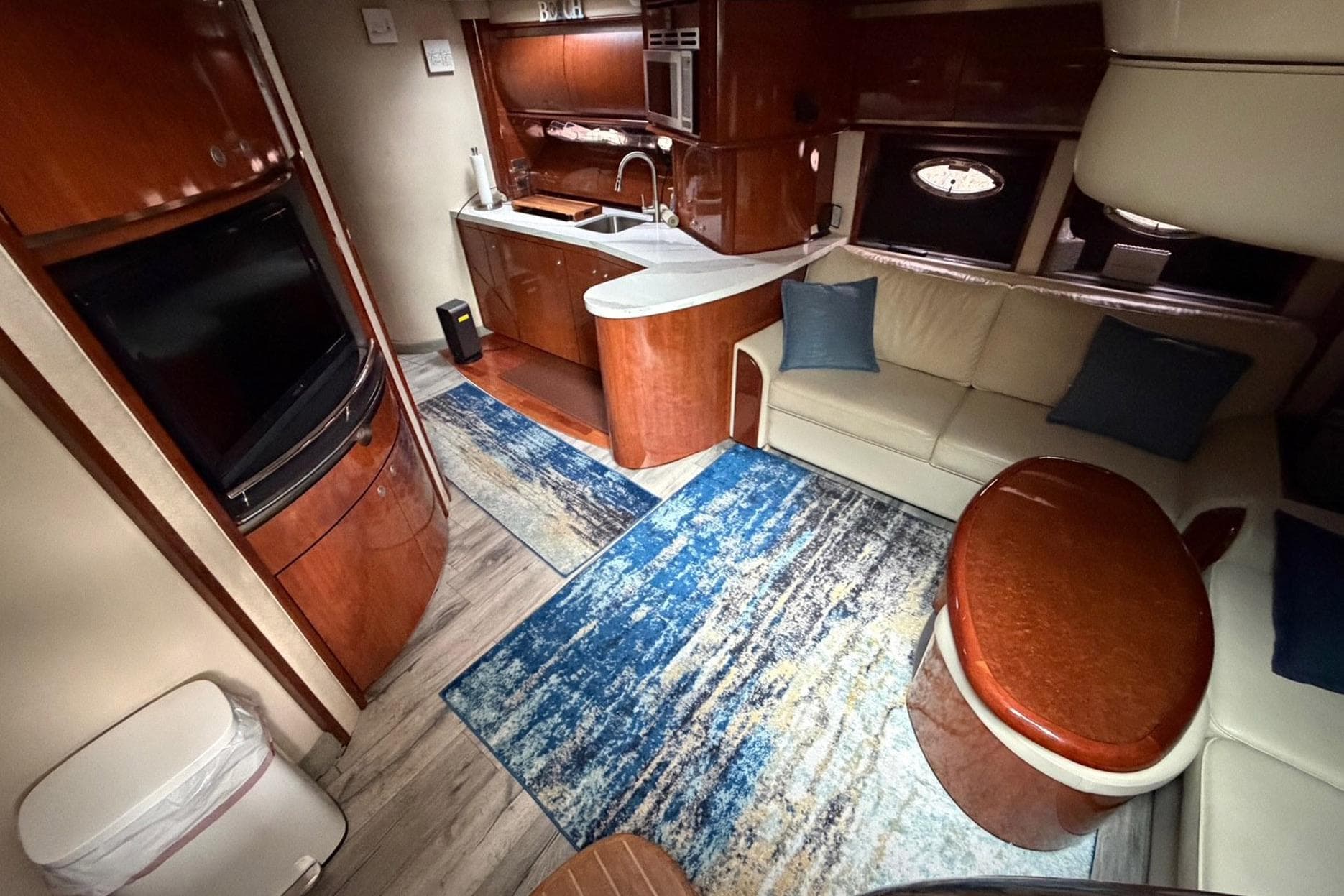 Luxurious interior of a 2004 Sea Ray 500 Sundancer yacht with modern amenities.