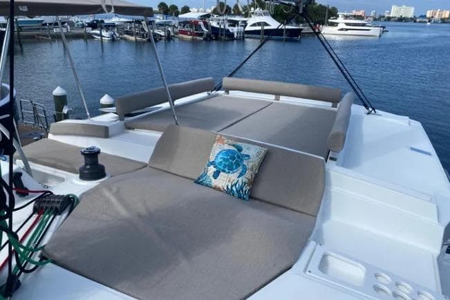 Luxurious 2023 Bali 4.2 yacht with spacious deck and scenic marina view.