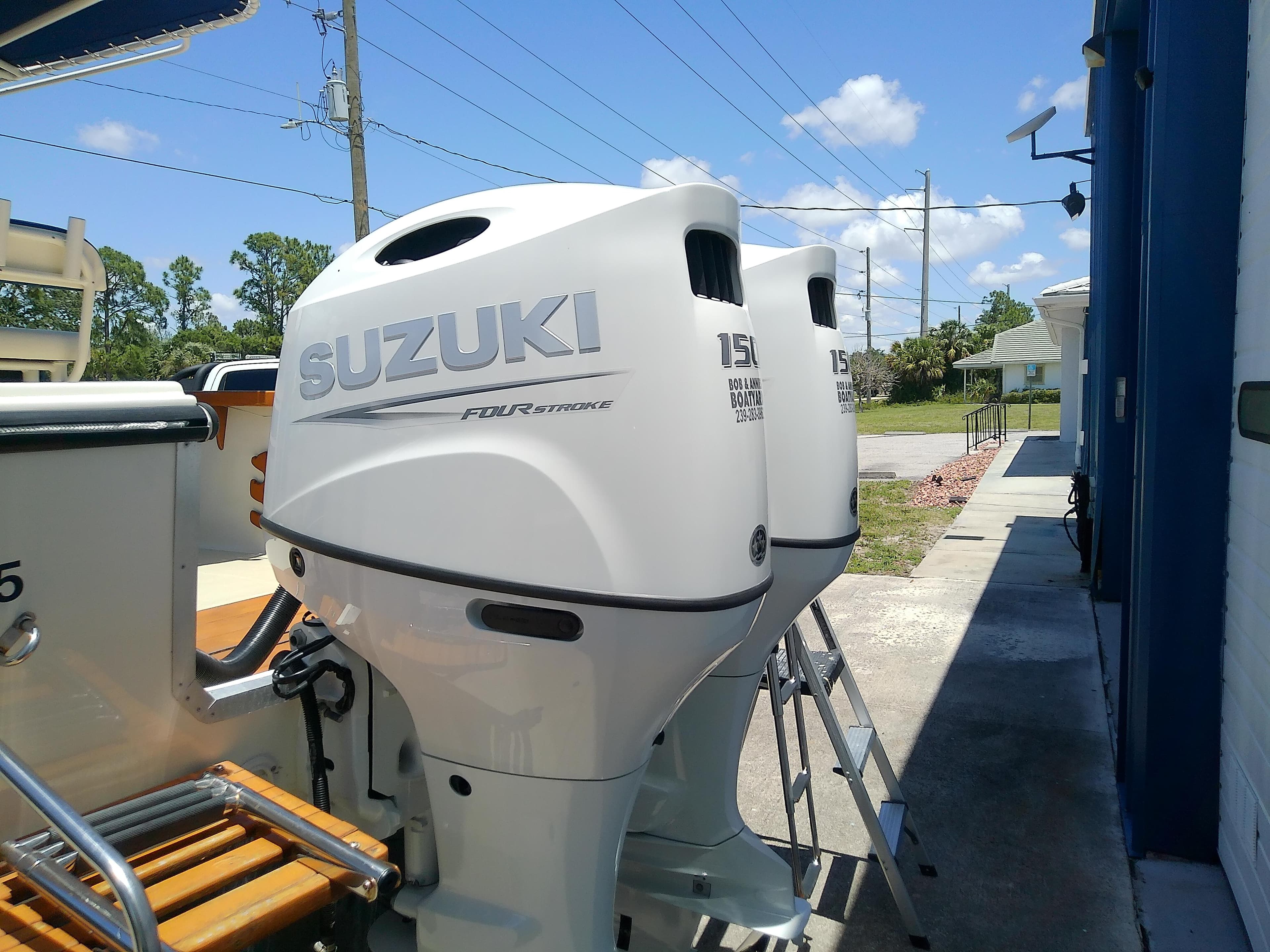 Twin Suzuki outboard motors on a 1985 Robalo 2520 Center Console boat.