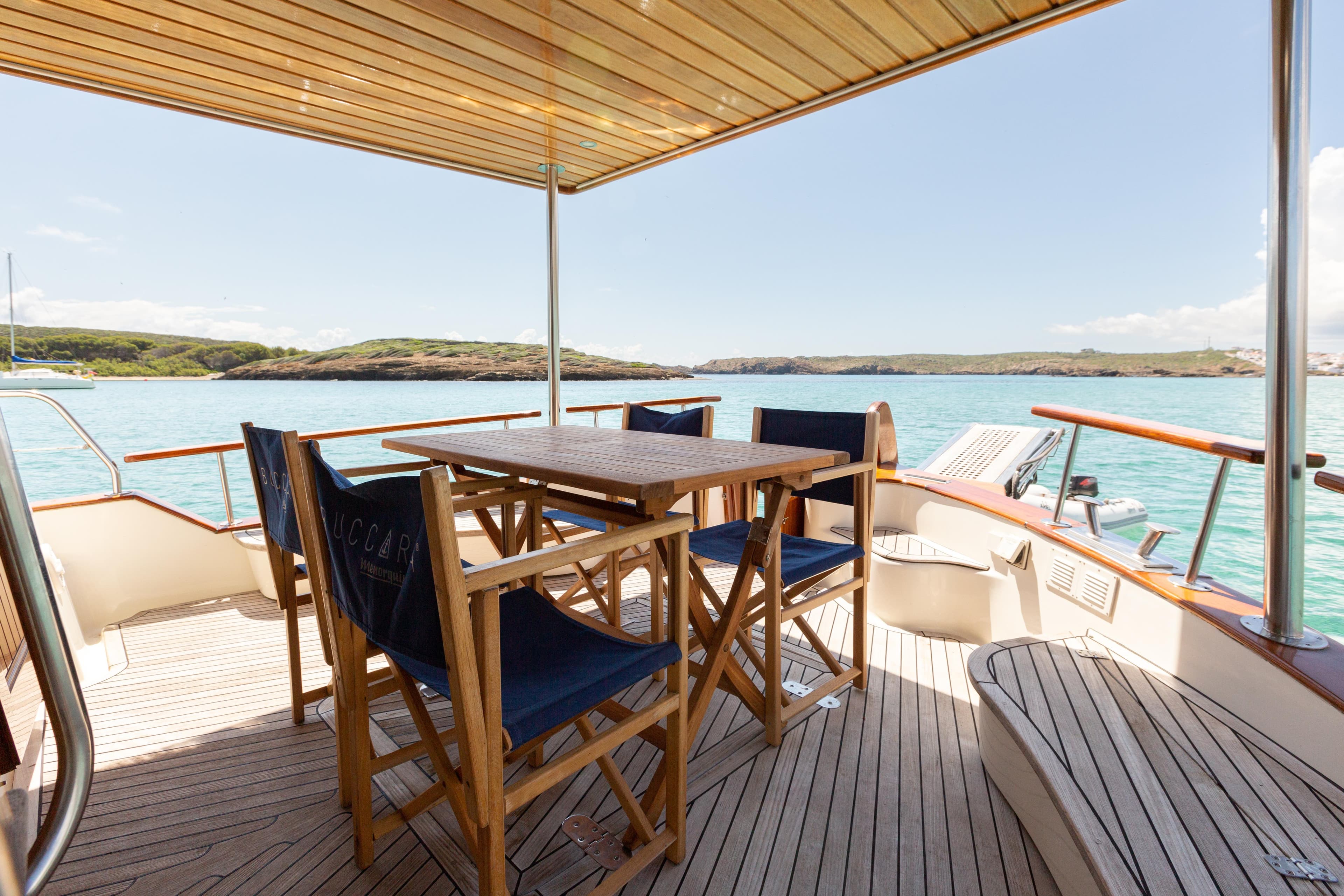 Outdoor seating on 2006 Menorquin 160 Fly yacht with ocean view.