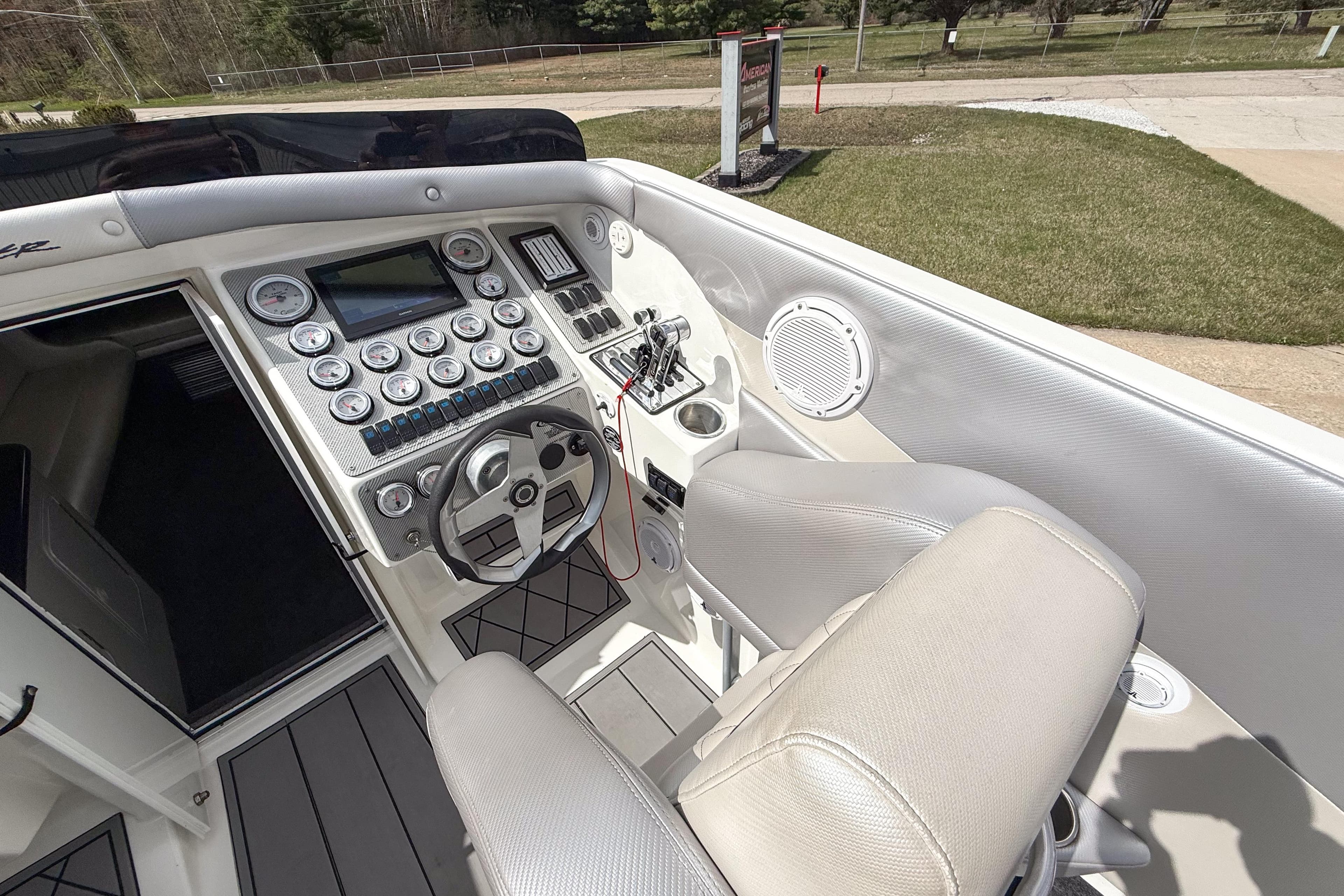 Cockpit of 2002 Active Thunder 37 boat with steering wheel and control panel.