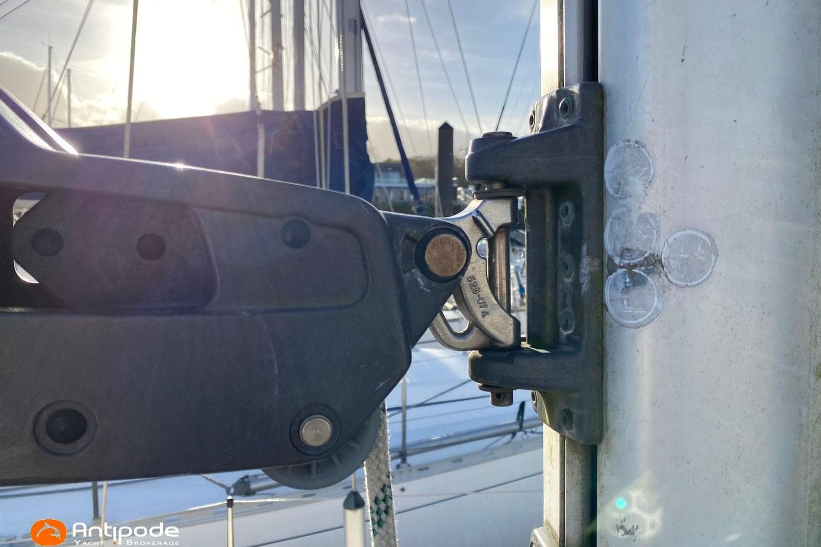 Close-up of a 1992 Hallberg-Rassy 36 sailboat rigging component in sunlight.