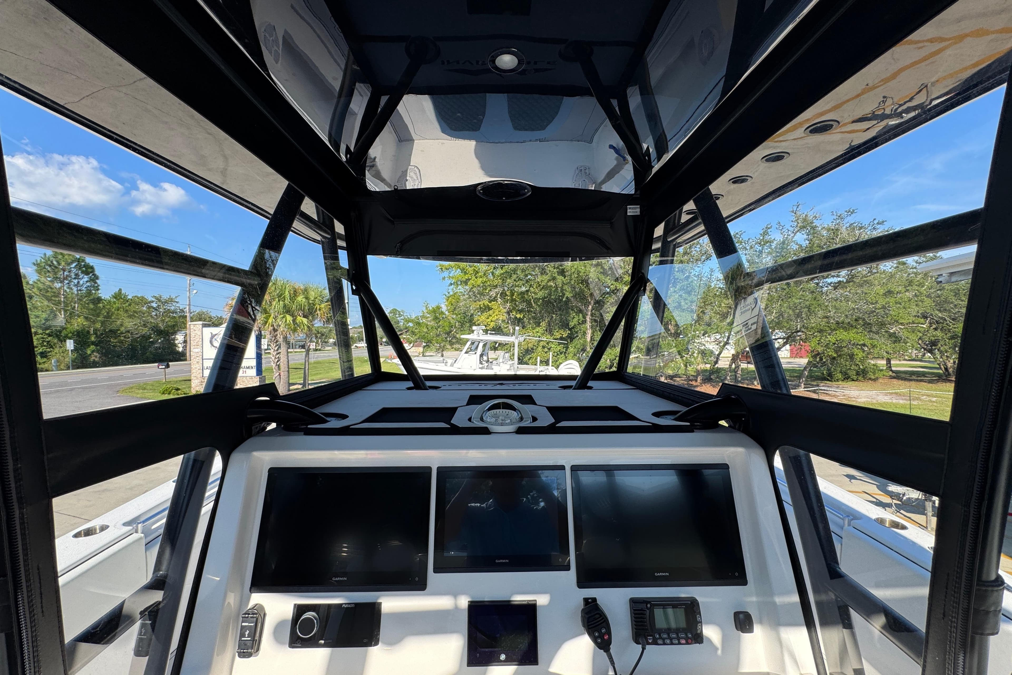 2023 Invincible 35 Catamaran cockpit with advanced navigation displays and panoramic views.