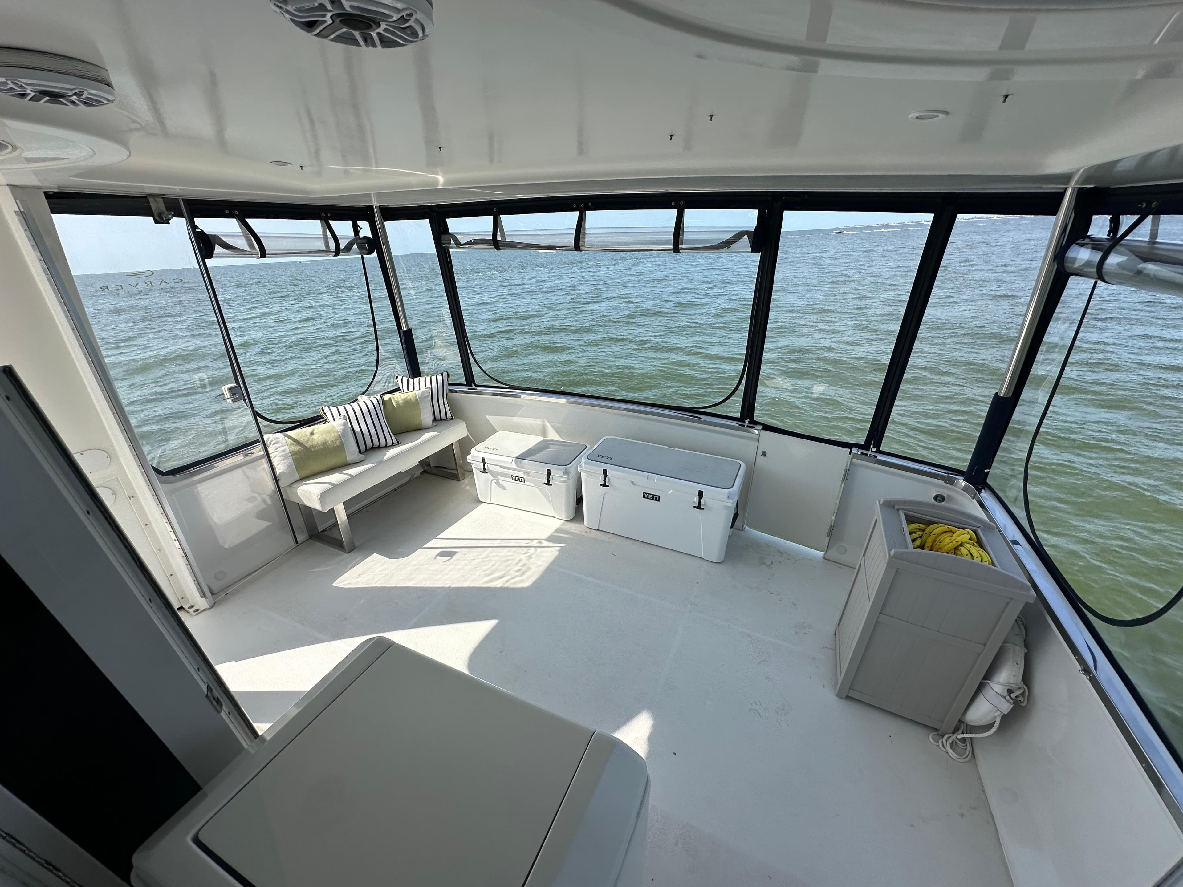 Interior view of 2000 Carver 406 Motor Yacht with ocean backdrop.