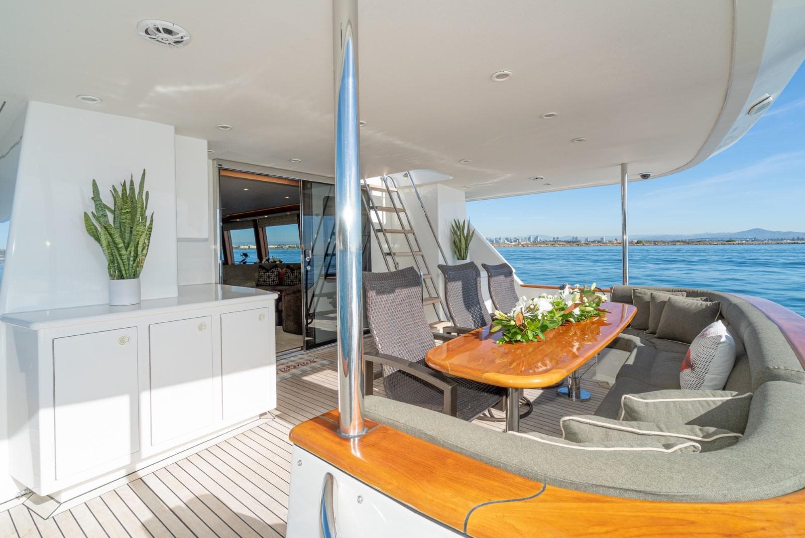 Luxurious 2002 Northstar COCKPIT MOTORYACHT deck with elegant seating and ocean view.