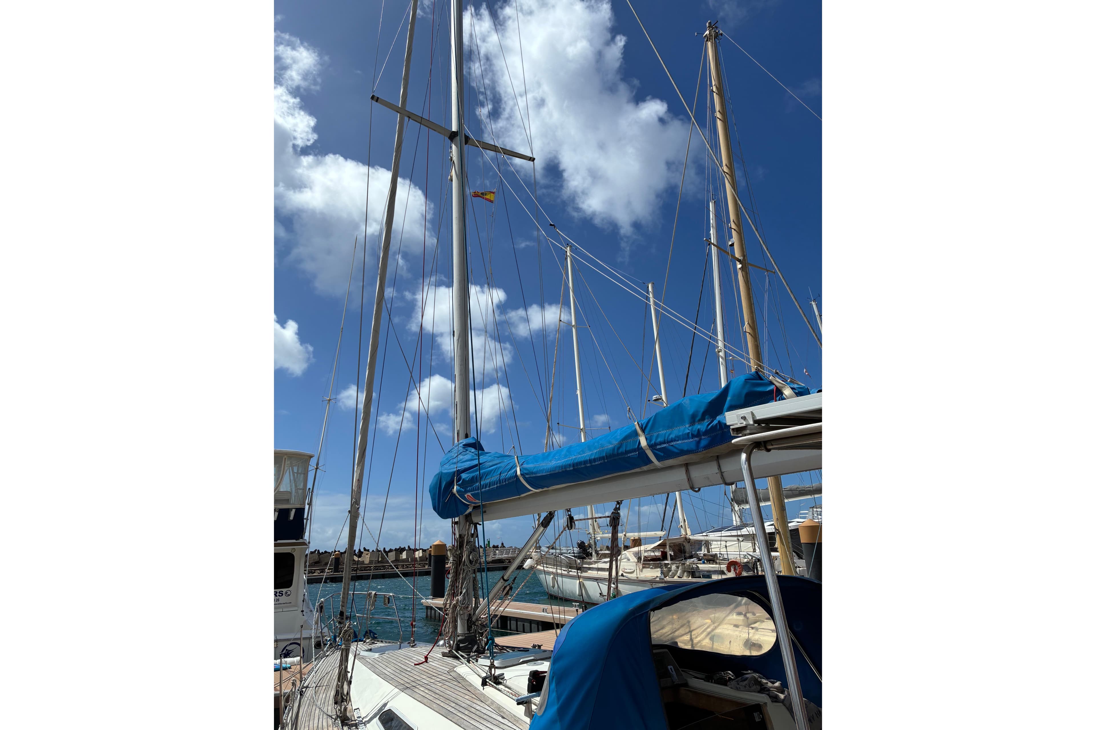 Sailing yacht Sweden Yachts 340, 1989 model, docked under a clear blue sky.