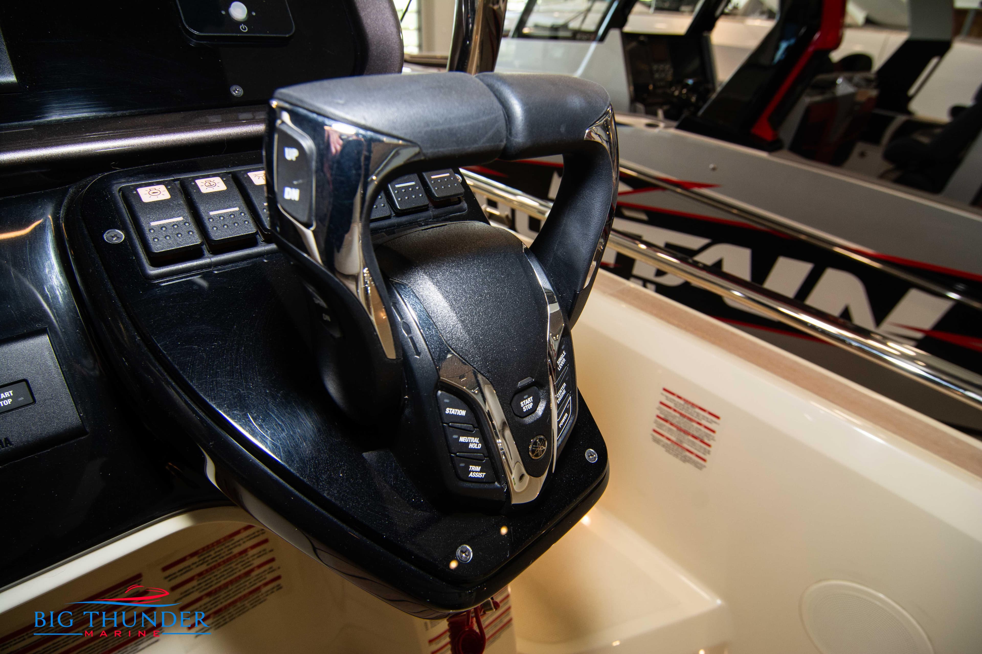2024 Invictus GT320S boat steering wheel and control panel.