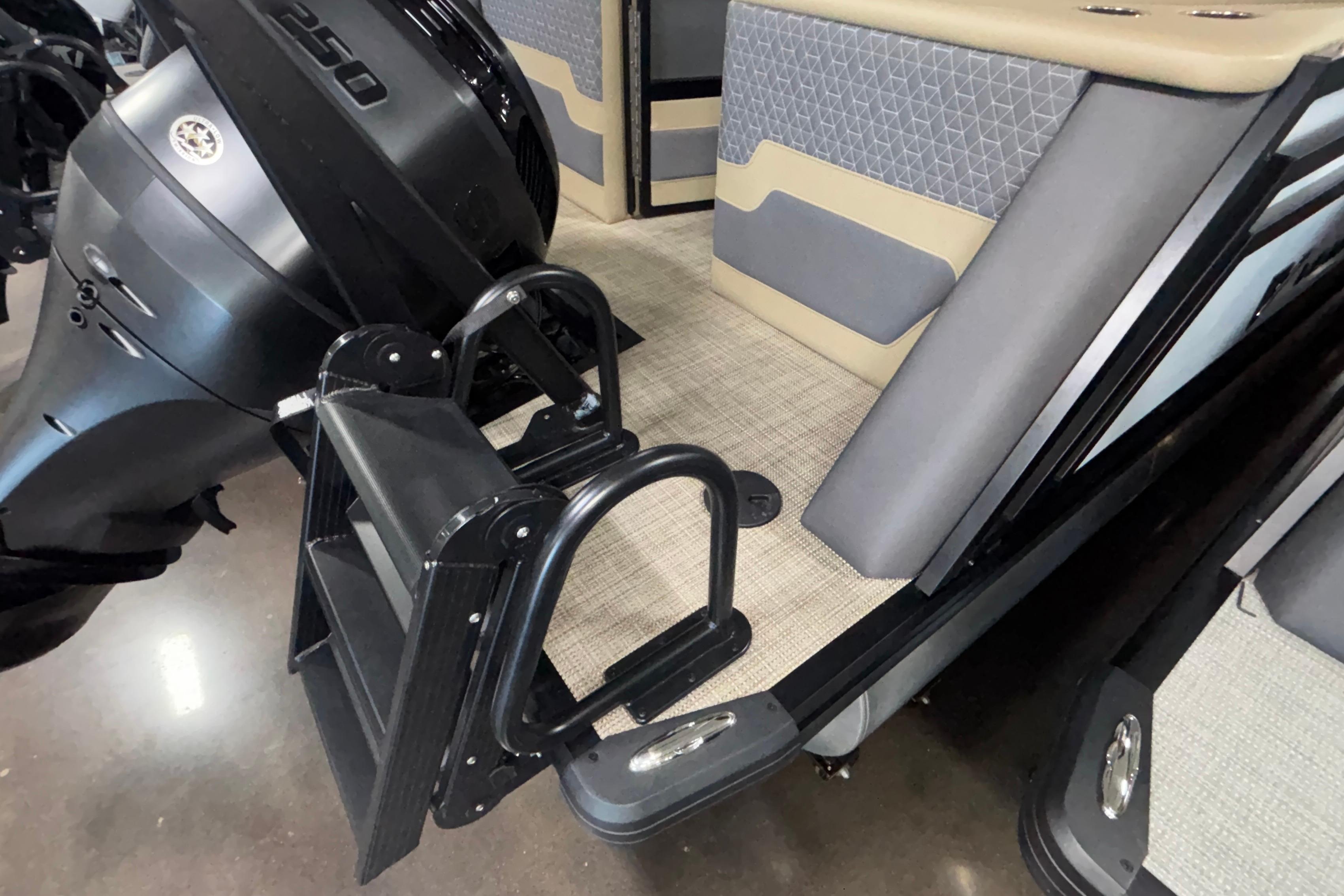 2026 Viaggio Z24U boat with motor and foldable ladder, featuring modern seating and flooring.