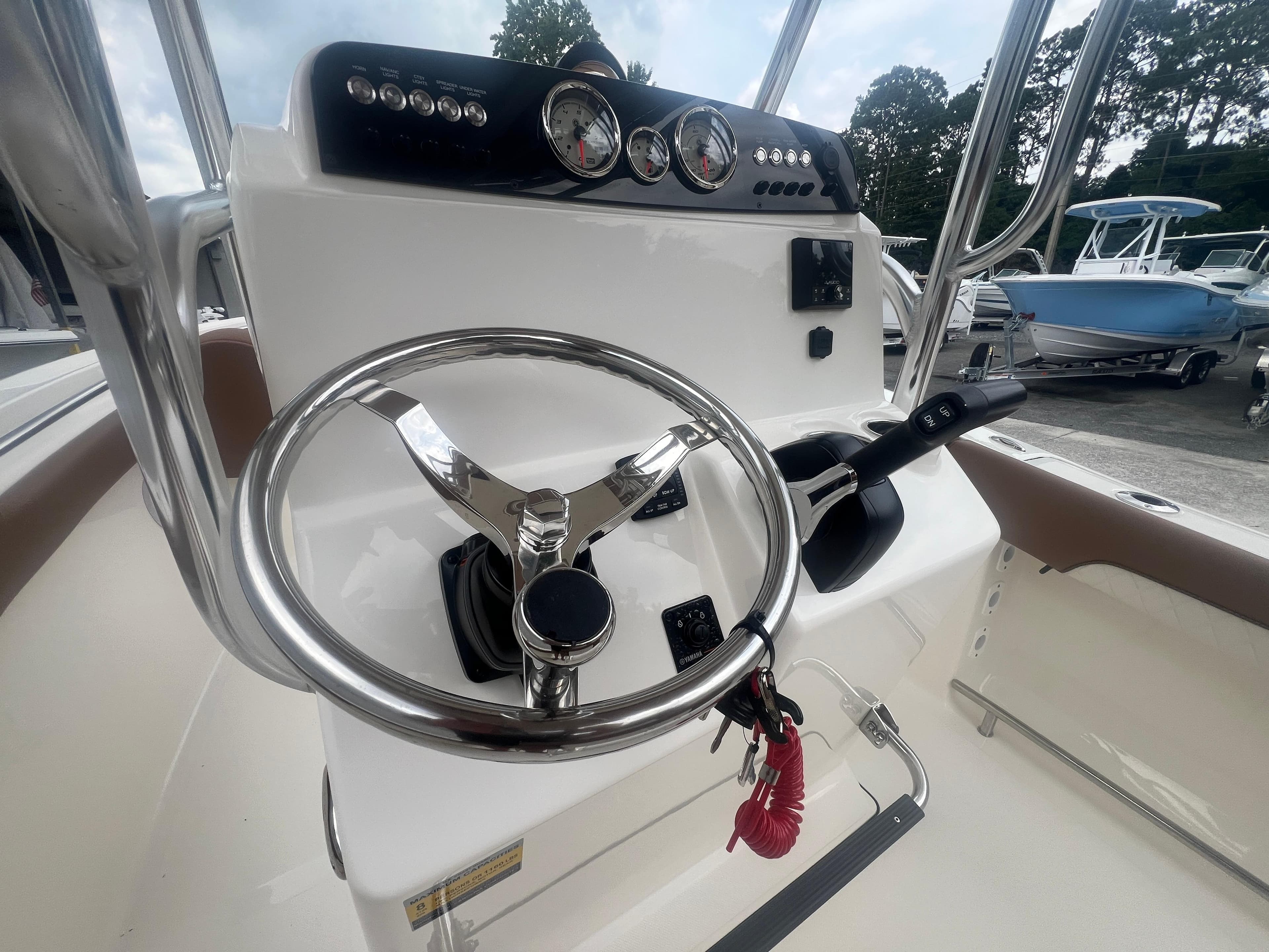 2026 Pioneer 202 Islander boat dashboard with steering wheel and controls.