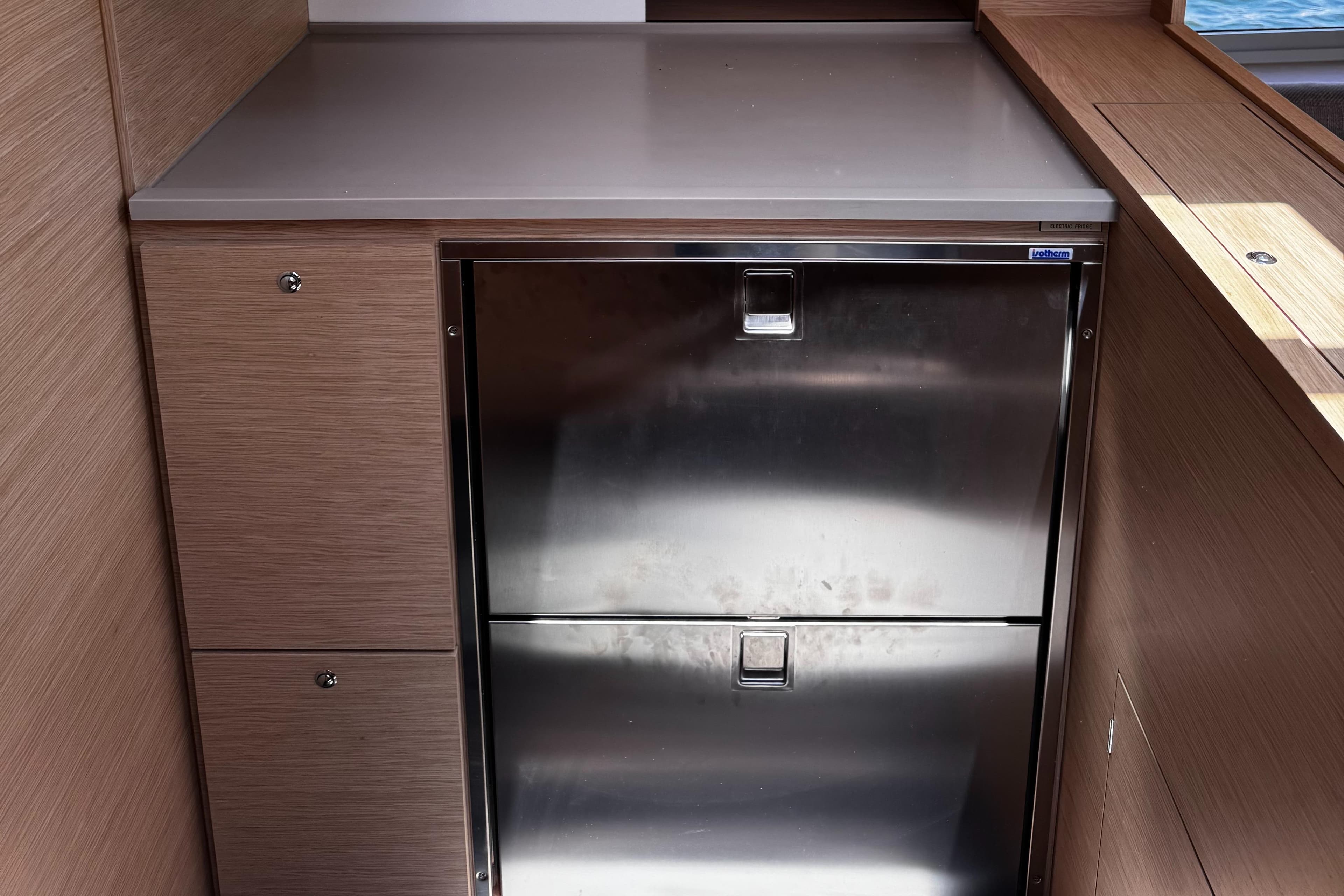 Stainless steel refrigerator in 2024 Dufour 470 yacht interior.