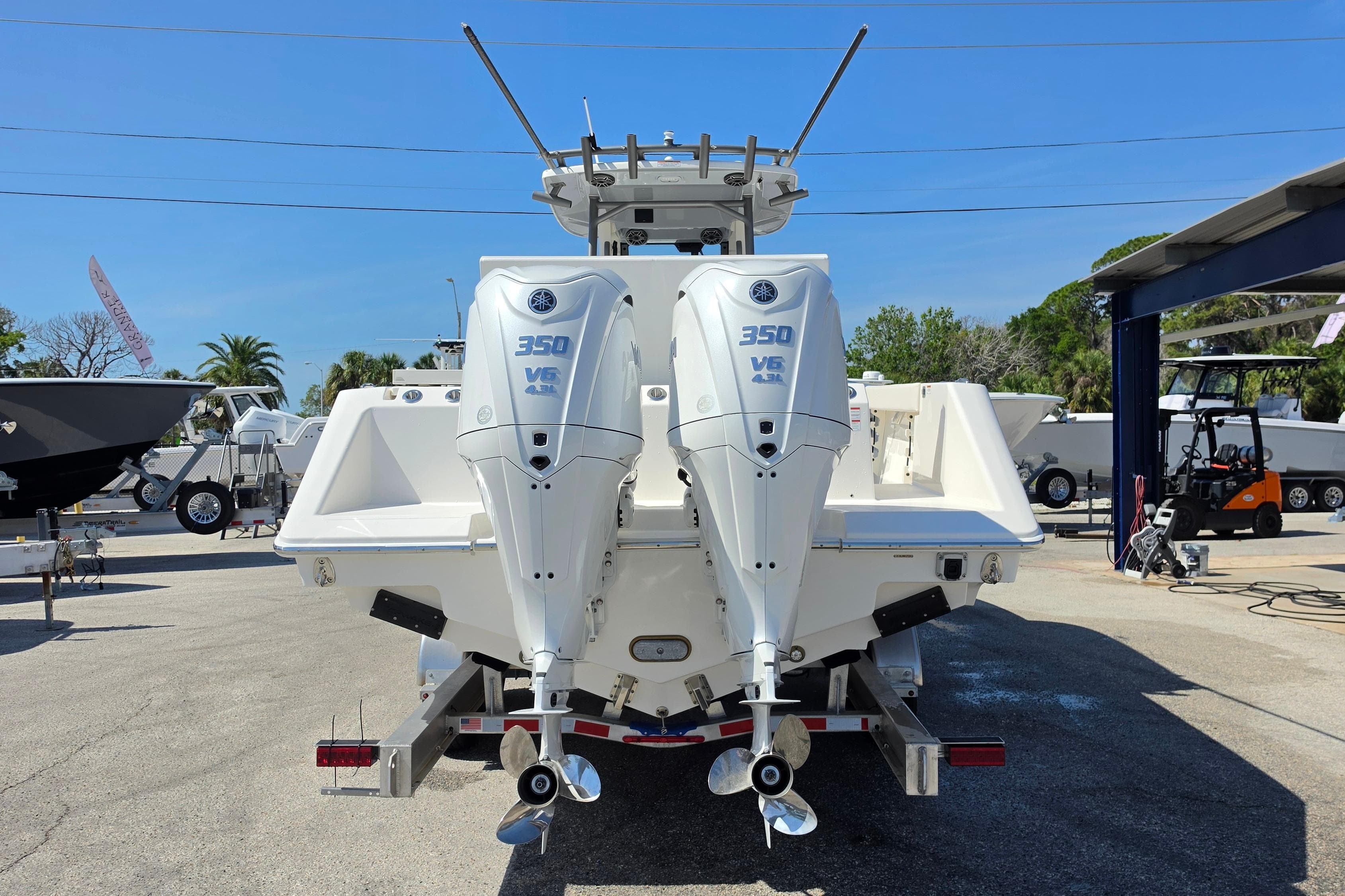 2026 Solace 30CS boat with dual 350 V6 outboard engines, displayed outdoors.