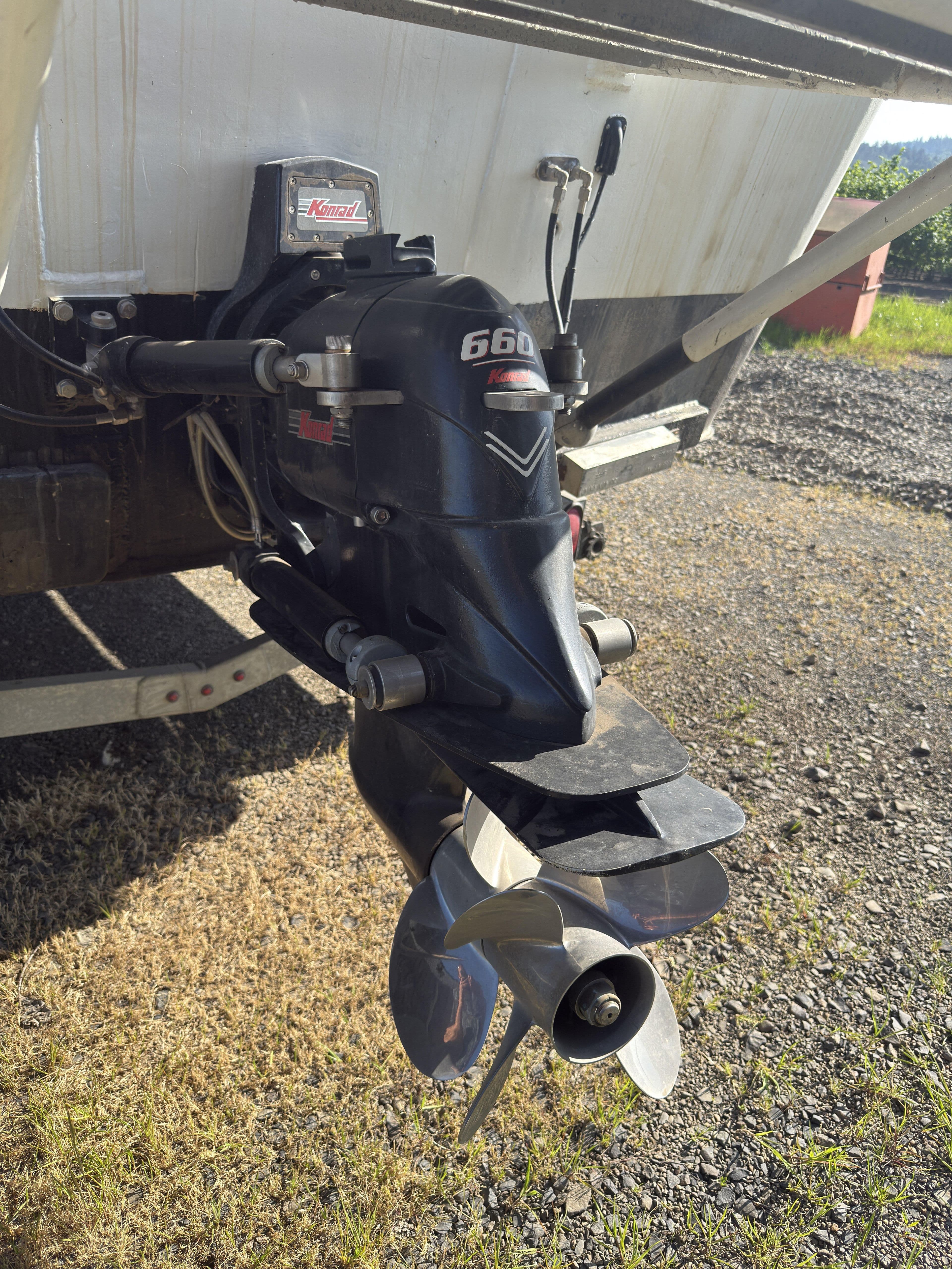 Outboard motor of a 1975 Monark 30 Fishing Boat on a trailer.