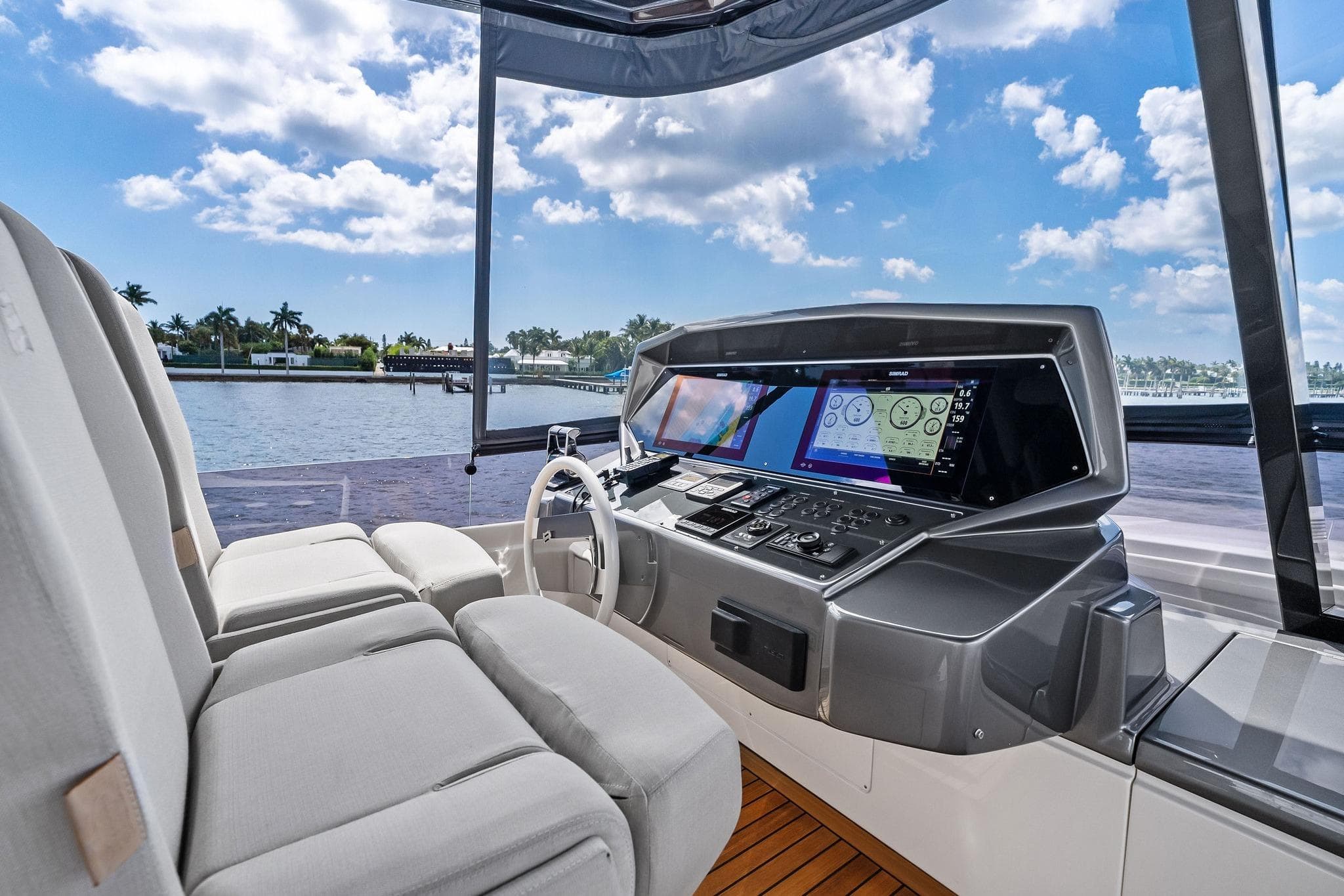 Luxurious helm of 2022 Ferretti Yachts 780 with advanced navigation systems and plush seating.