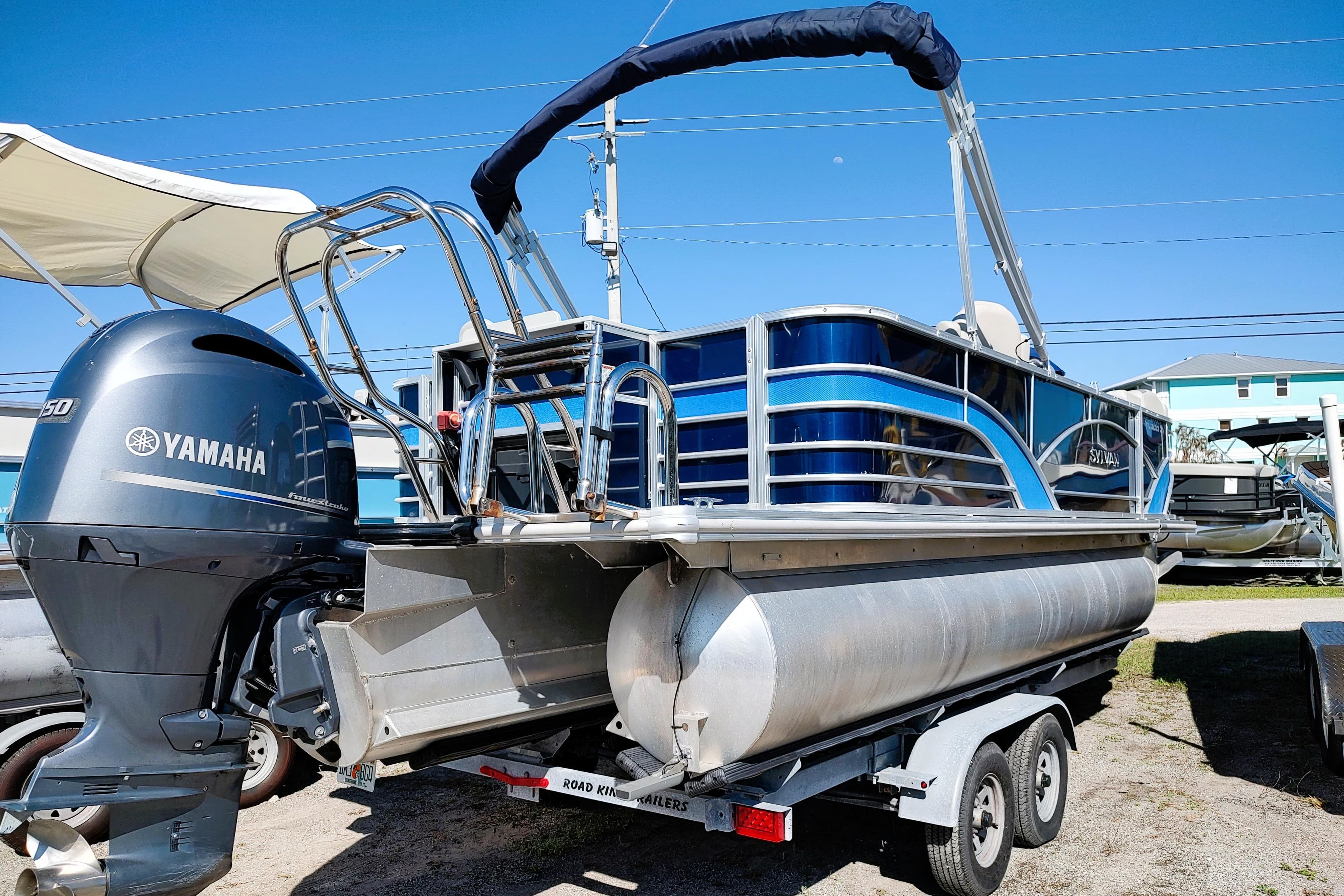 2019 Sylvan Mirage Fish 8520 Party Fish pontoon boat with Yamaha engine on trailer.