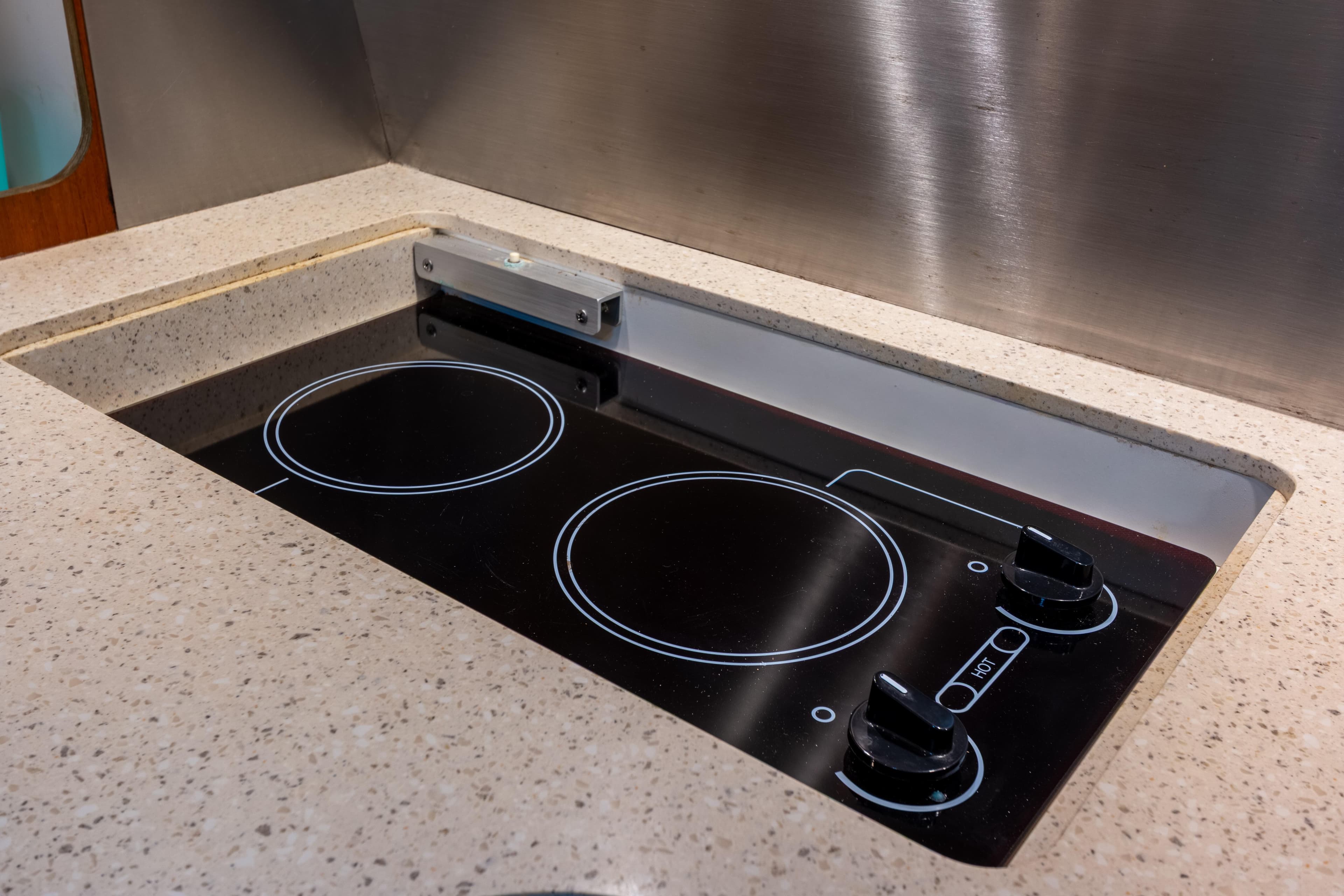 Modern stovetop in 2007 Tiara Yachts 3800 Open galley kitchen.