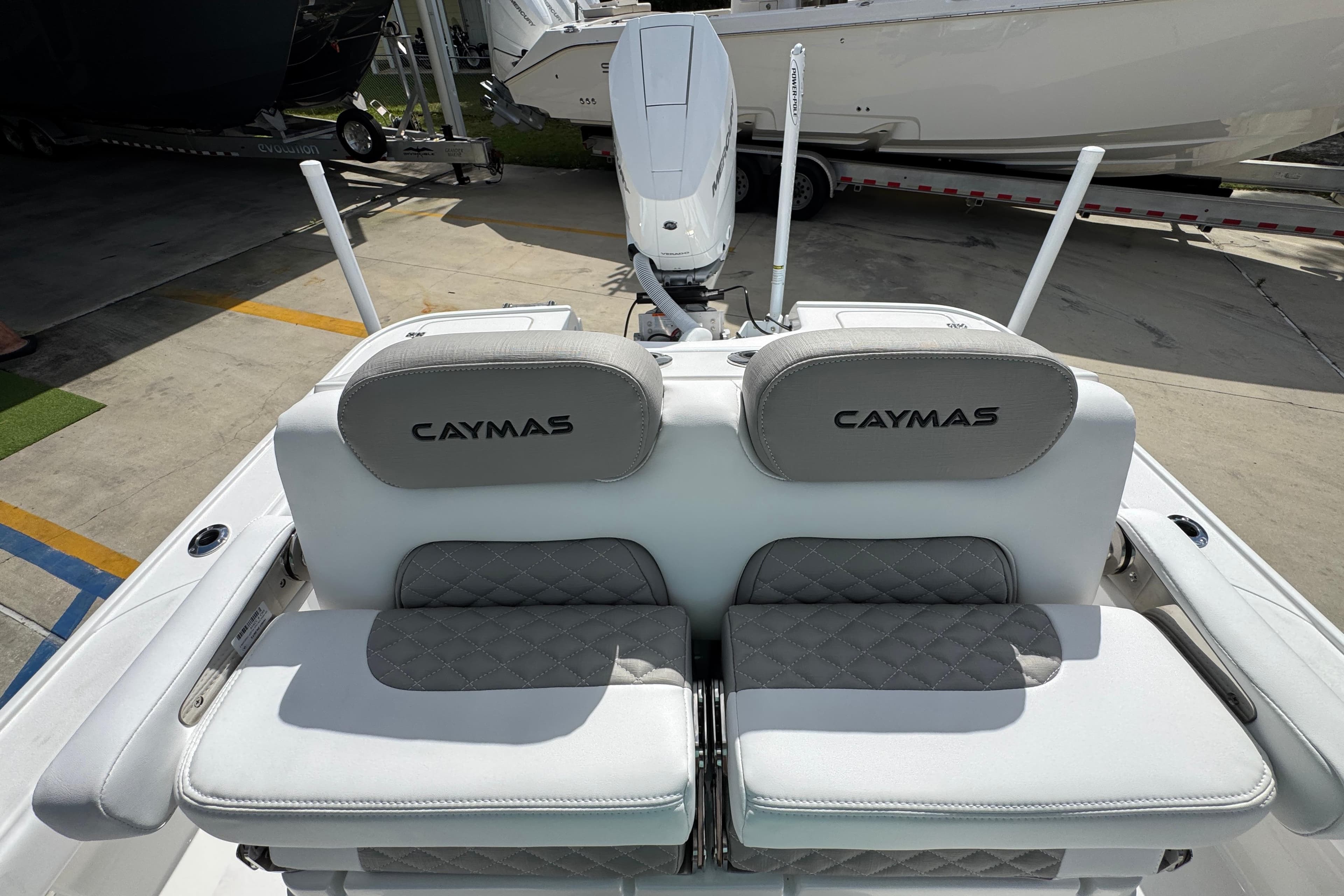 2026 Caymas 26 HB boat seats with logo, featuring sleek design and comfortable cushioning.