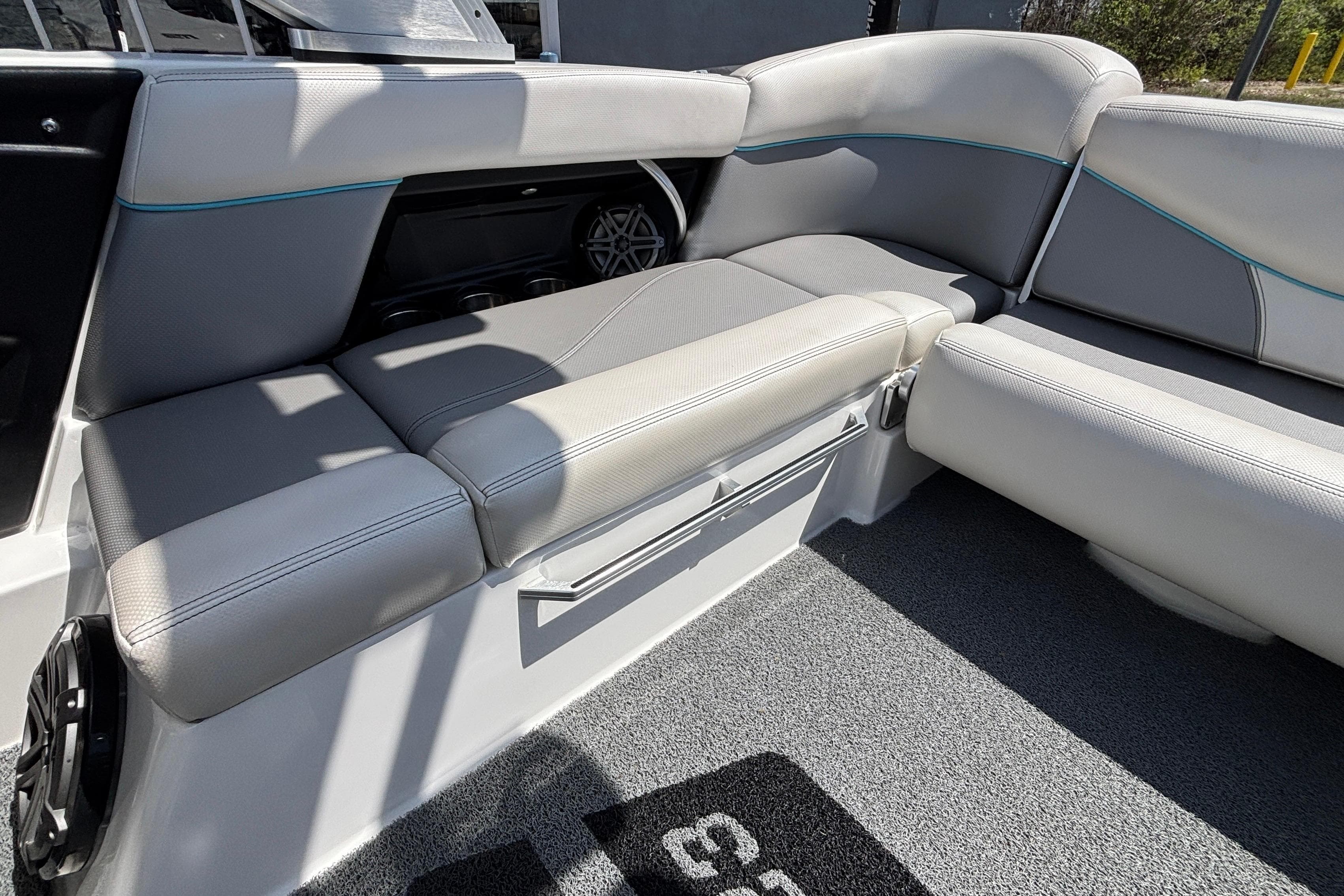 2017 MasterCraft XT23 boat interior with gray seating and speaker system.