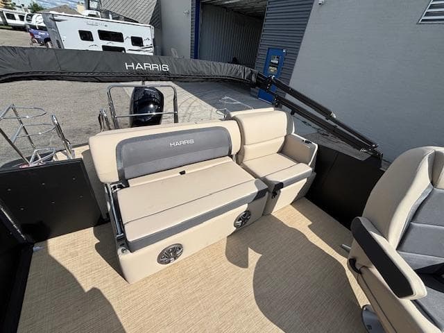 2025 Harris CRUISER 230 SLDH pontoon boat interior with beige seating and modern design.