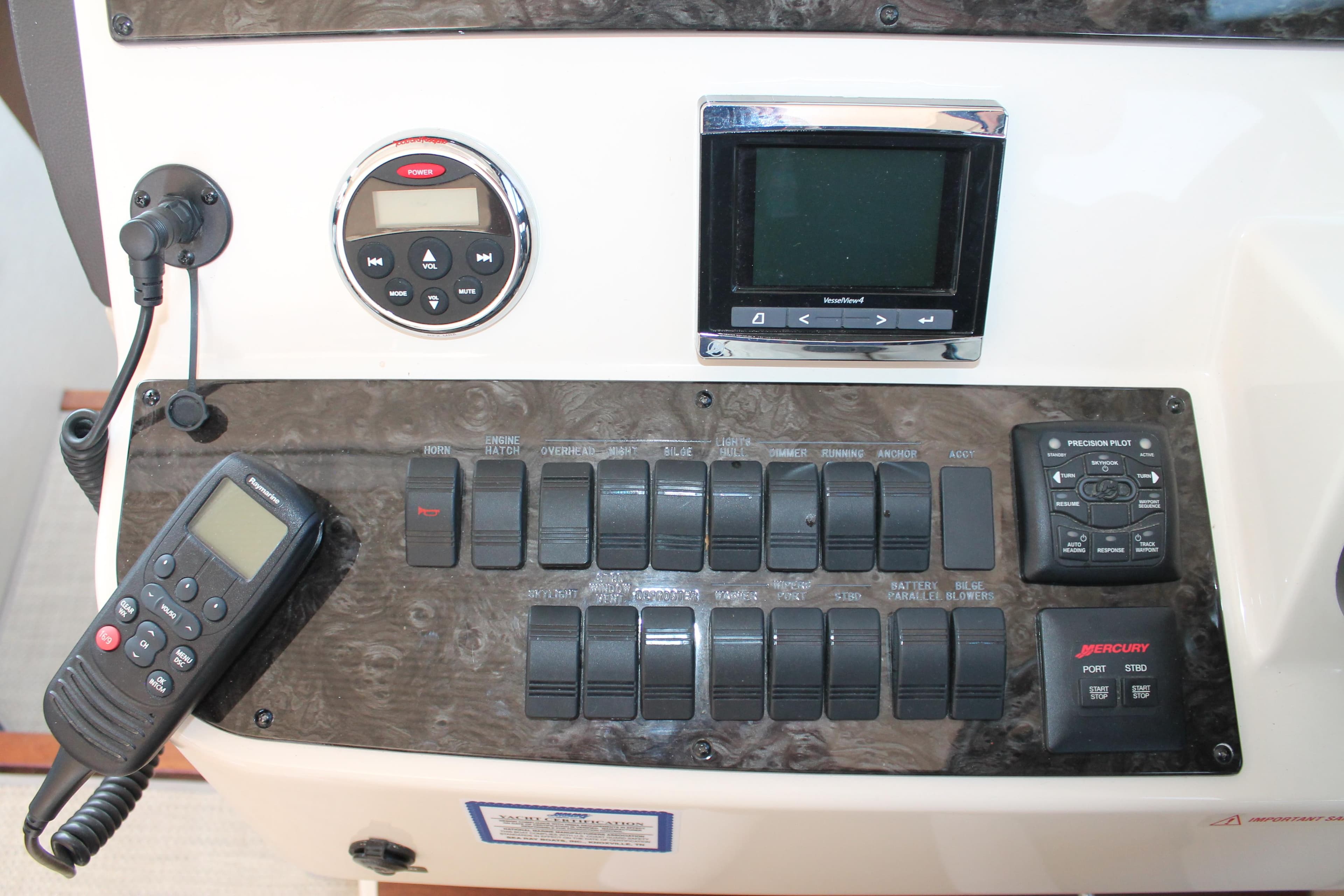 Control panel of 2015 Sea Ray 470 Sundancer with switches and navigation equipment.