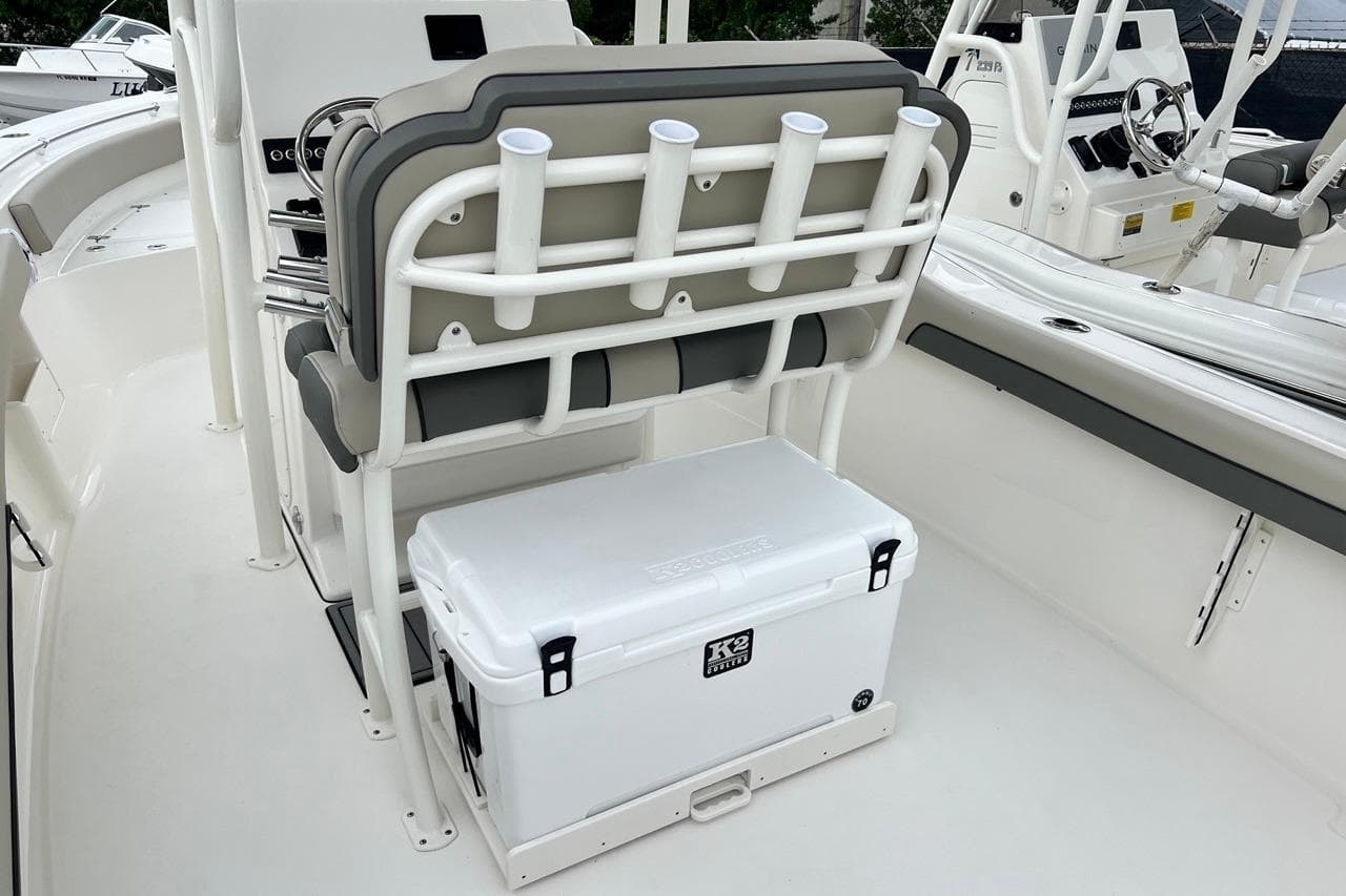 2026 Key West 239 FS boat interior with seating and cooler storage.
