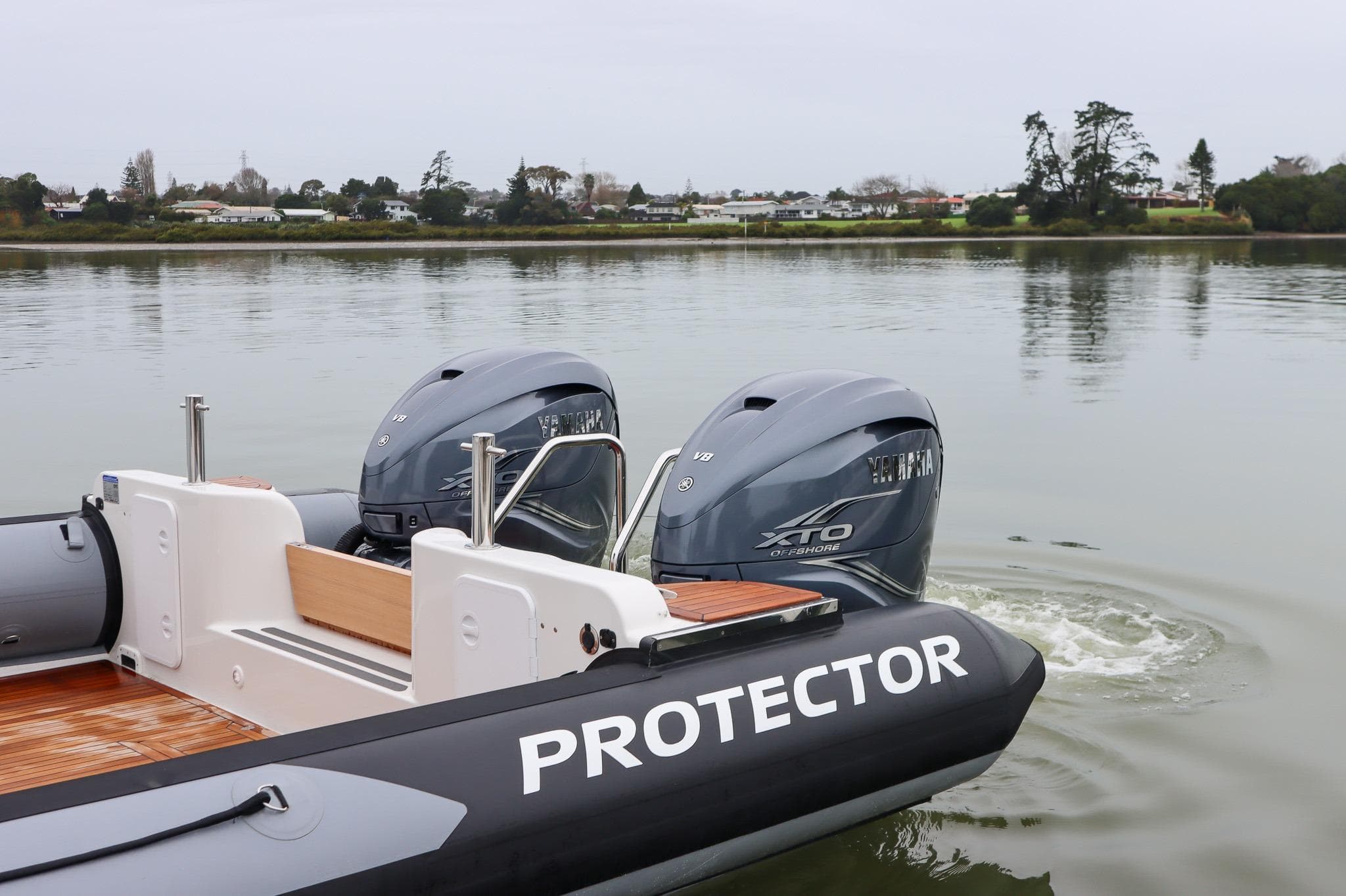 2022 Rayglass Protector 410 Targa with dual Yamaha XTO engines on calm water.