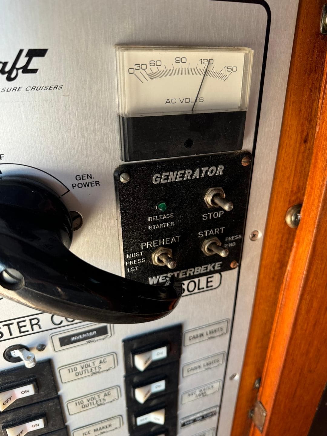 Control panel of a 1984 Tollycraft 48 Cockpit Motor Yacht with generator switches.