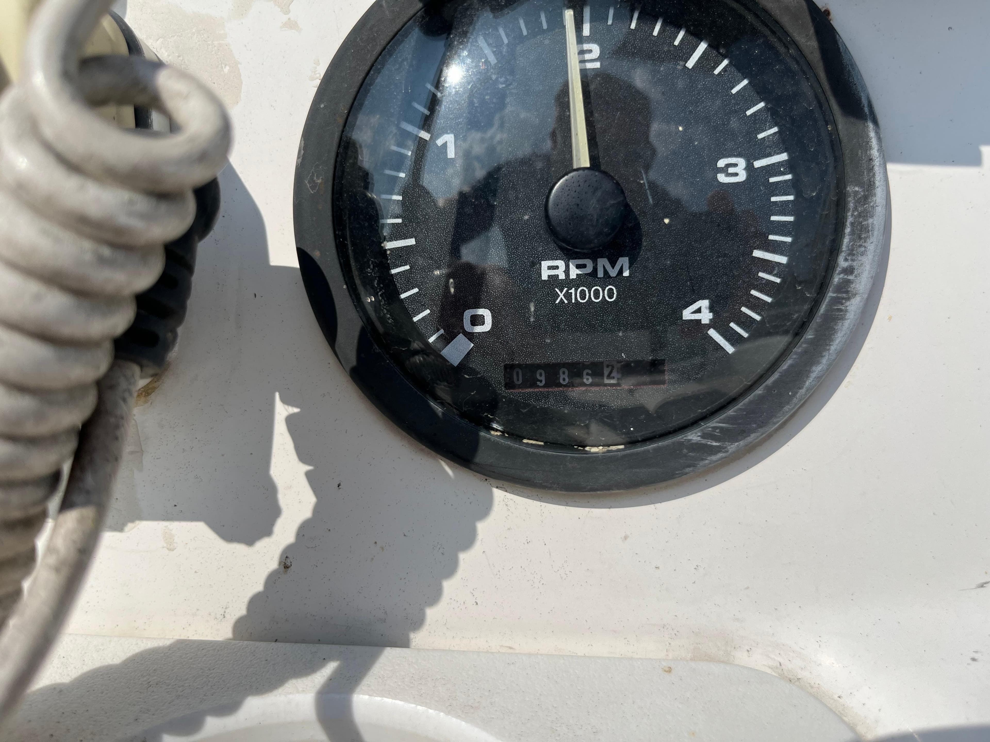 Close-up of a Hunter 340 tachometer showing RPM and odometer reading.