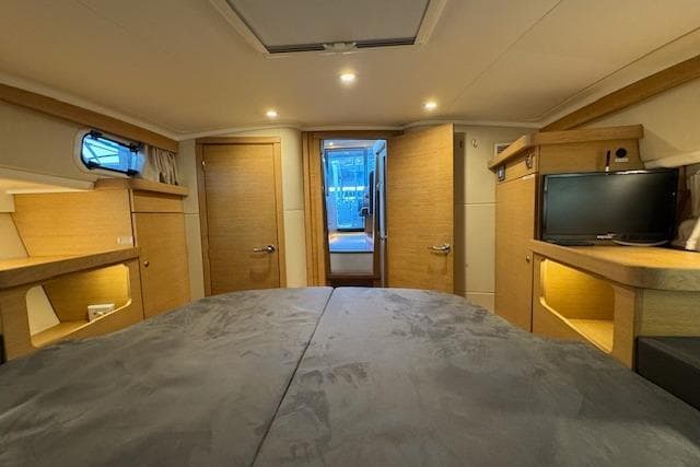 Luxurious interior of 2022 Nimbus 365 Coupe yacht, featuring cozy cabin and modern amenities.