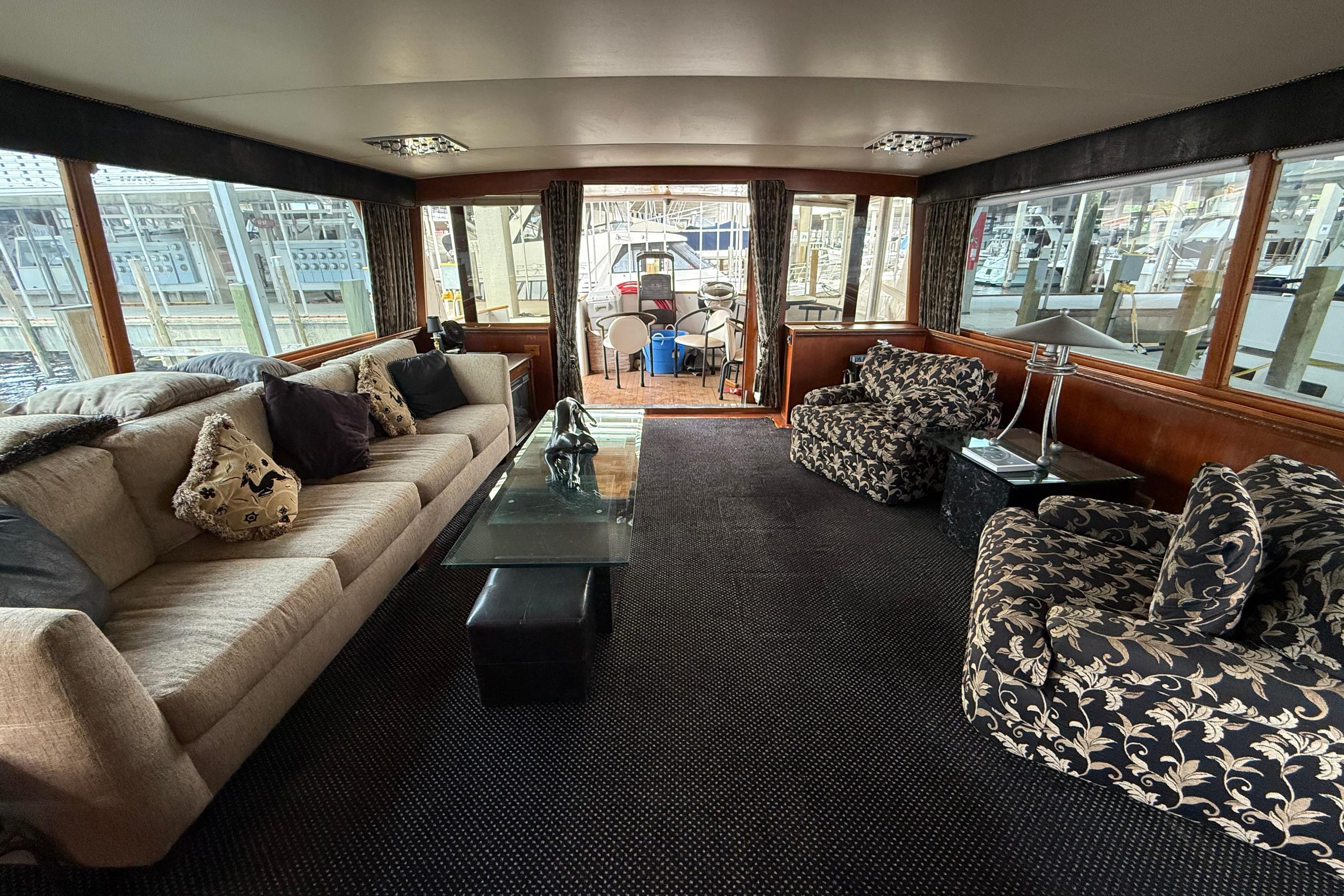 Luxurious interior of a 1974 Pacemaker Cockpit Motoryacht with elegant seating and decor.